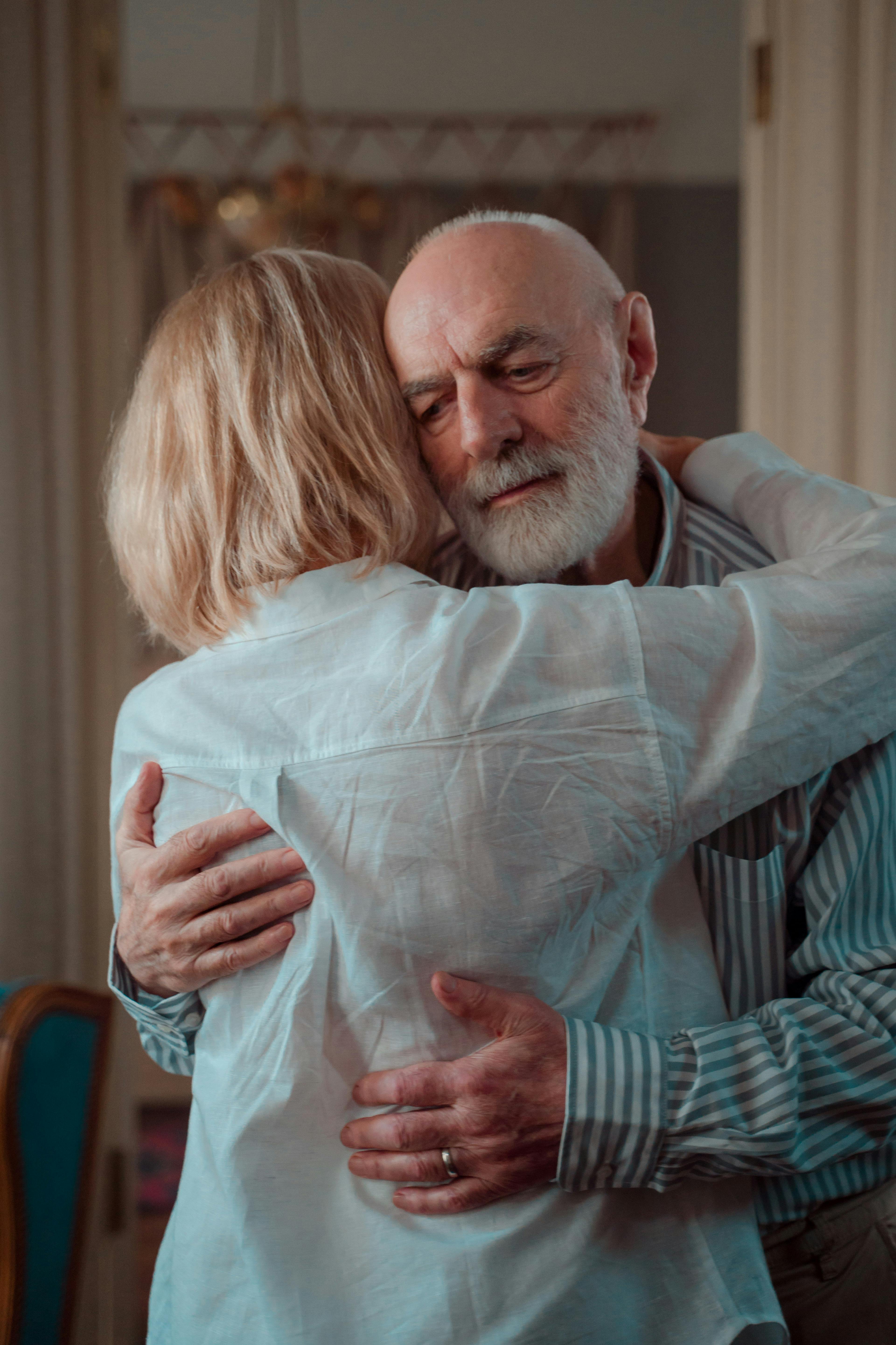 A senior man hugging his daughter | Source: Pexels
