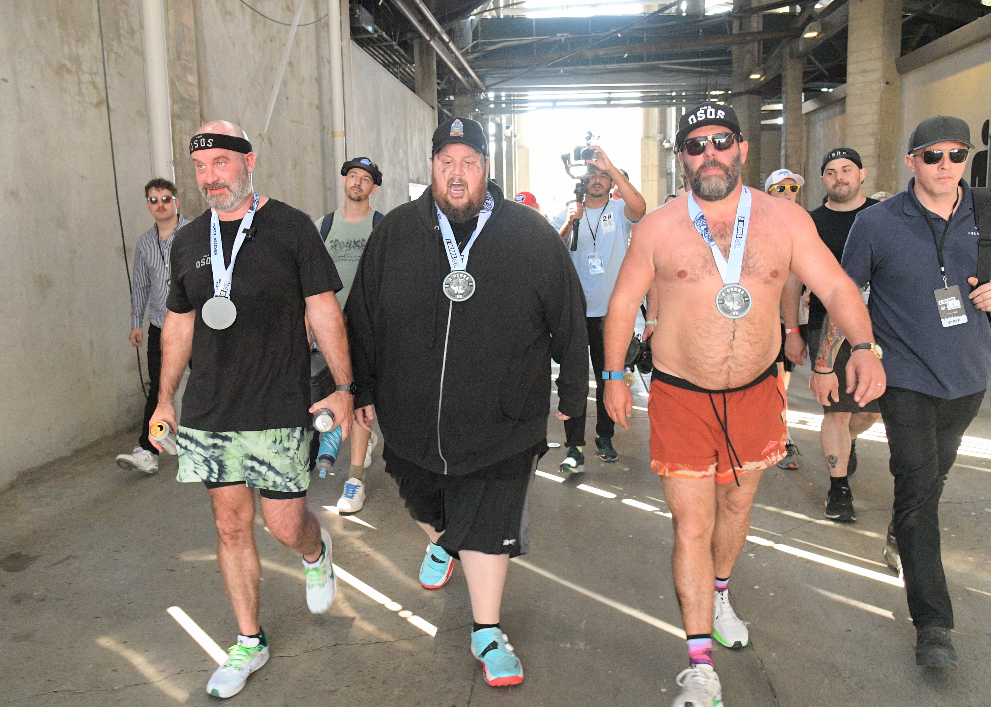 Tom Segura, Jelly Roll, and Bert Kreischer walk at the Netflix is a Joke Fest: 2 Bears 5K in Pasadena, California on May 7, 2024 | Source: Getty Images