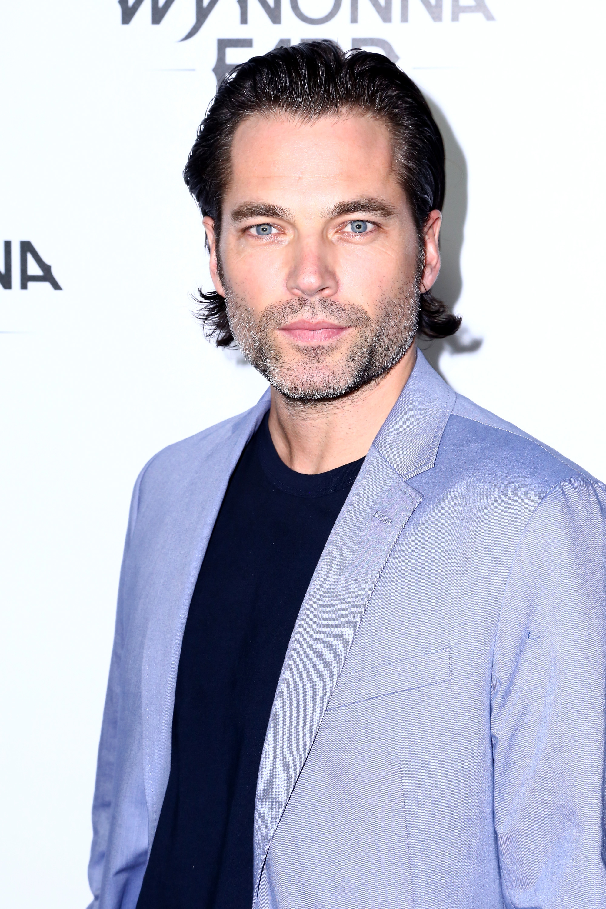 Tim Rozon attends the premiere of "Wynonna Earp" at WonderCon 2016 on March 26, 2016, in Los Angeles, California. | Source: Getty Images