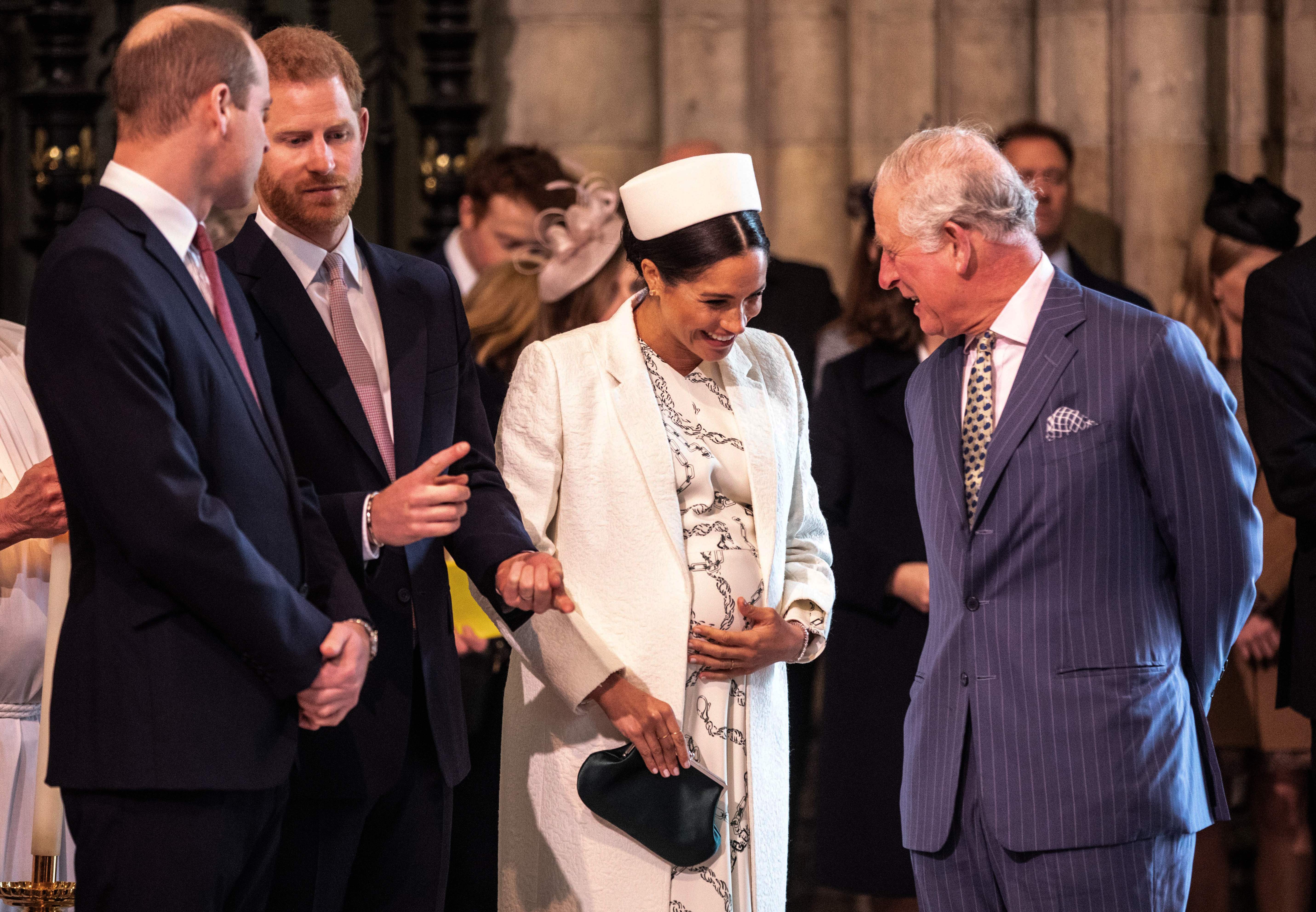 Meghan Markle pictured laughing with Prince Charles as Prince William engages with his brother Prince Harry during the Commonwealth Day service at Westminster Abbey on March 11, 2019 in London. / Source: Getty Images