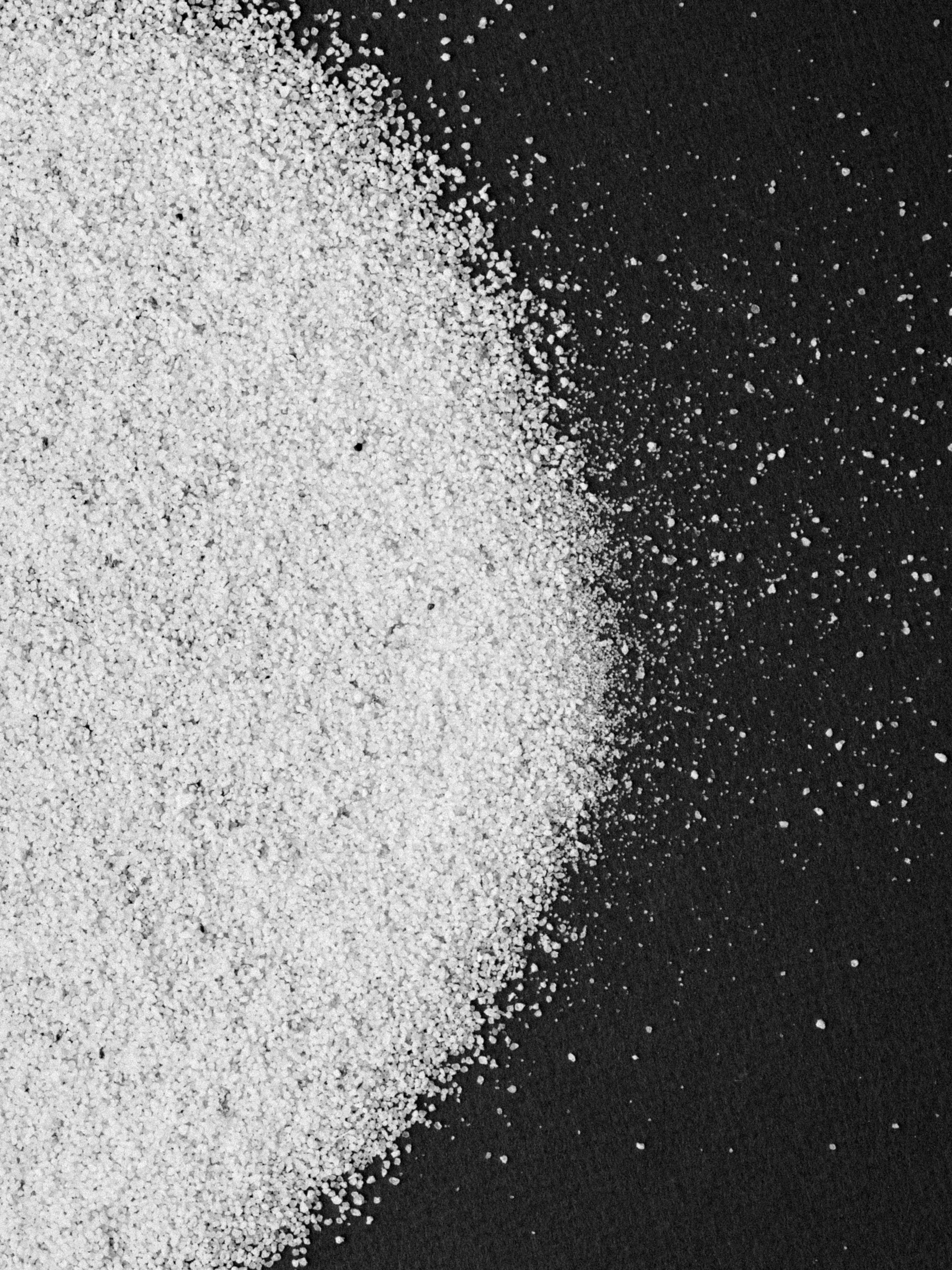White powder on a black surface | Source: Unsplash