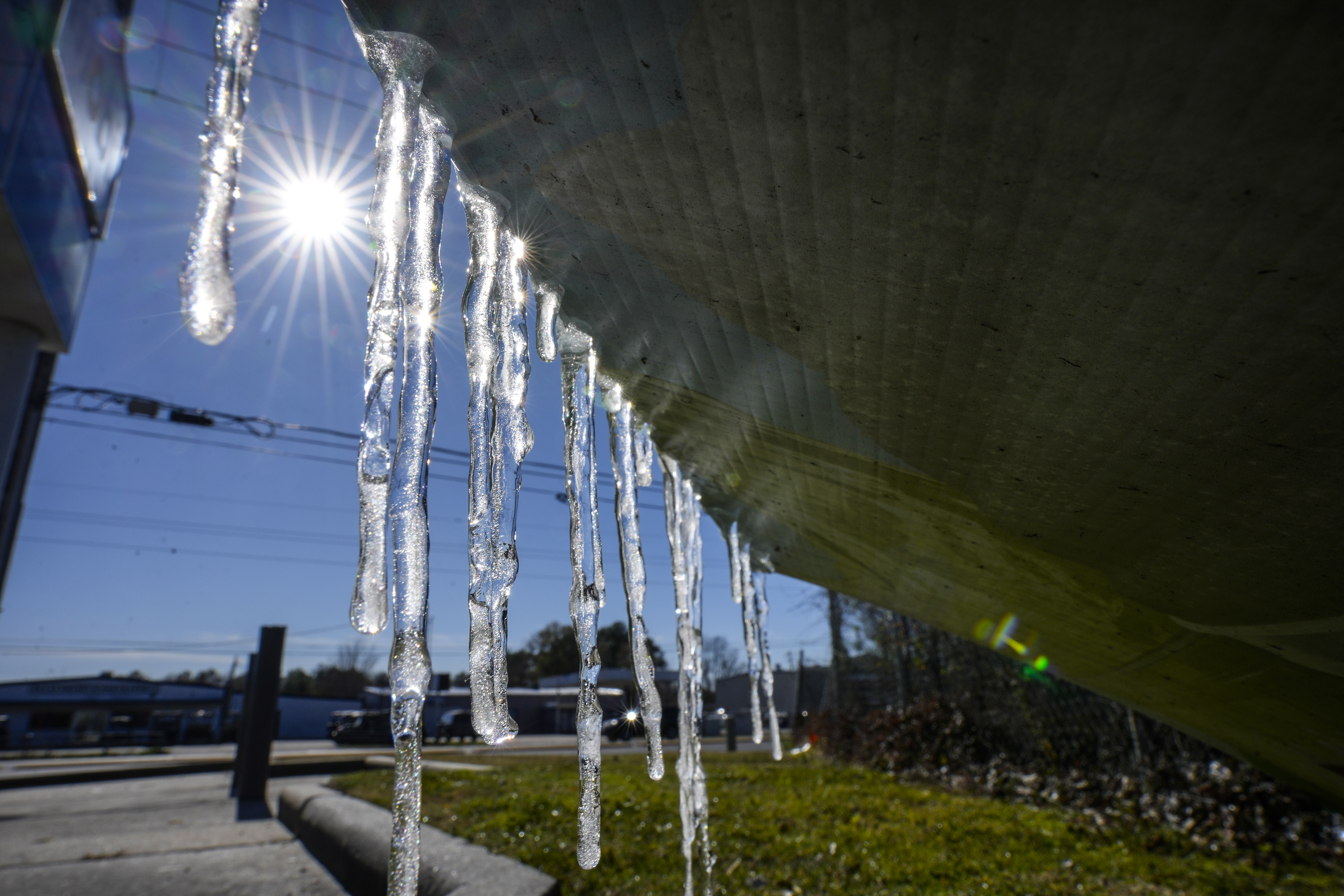 Icicles form on a sign at a convenience store along FM 2920 in Spring, Texas, on January 16, 2024 | Source: Getty Images