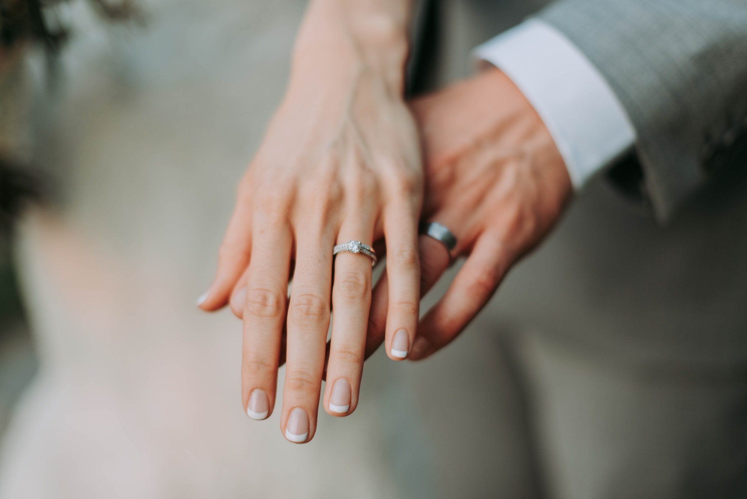 A couple is pictured showing their wedding rings. | Source: Unsplash