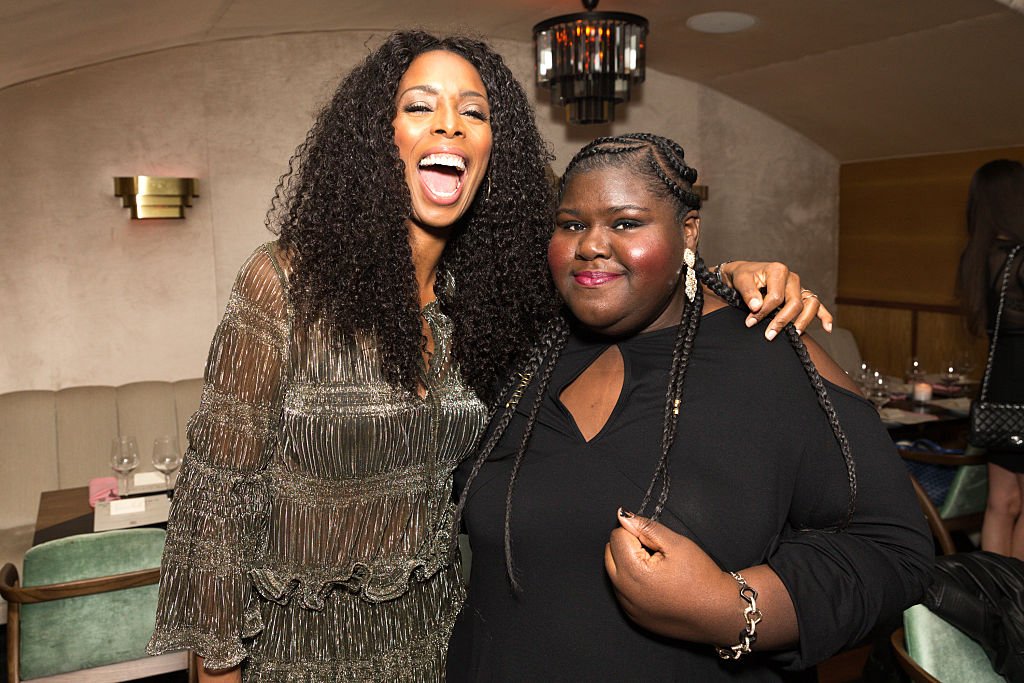 Tasha Smith and Gabourey Sidibe attend Lee Daniels Cover Launch with Louis XIII and Rolls-Royce, on December 7, 2016, in West Hollywood, California | Source: Rochelle Brodin/Getty Images for Haute Living