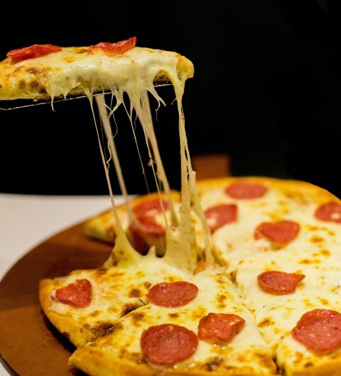 Ryan had given Olivia less than the cost of a pizza as a bonus. | Source: Unsplash