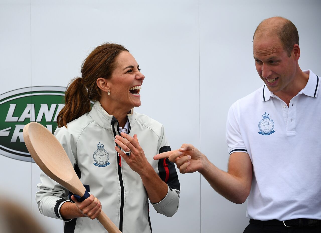 Kate Middleton accepts the giant wooden spoon at the prize-giving ceremony during the King's Cup charity race event. | Source: Getty Images