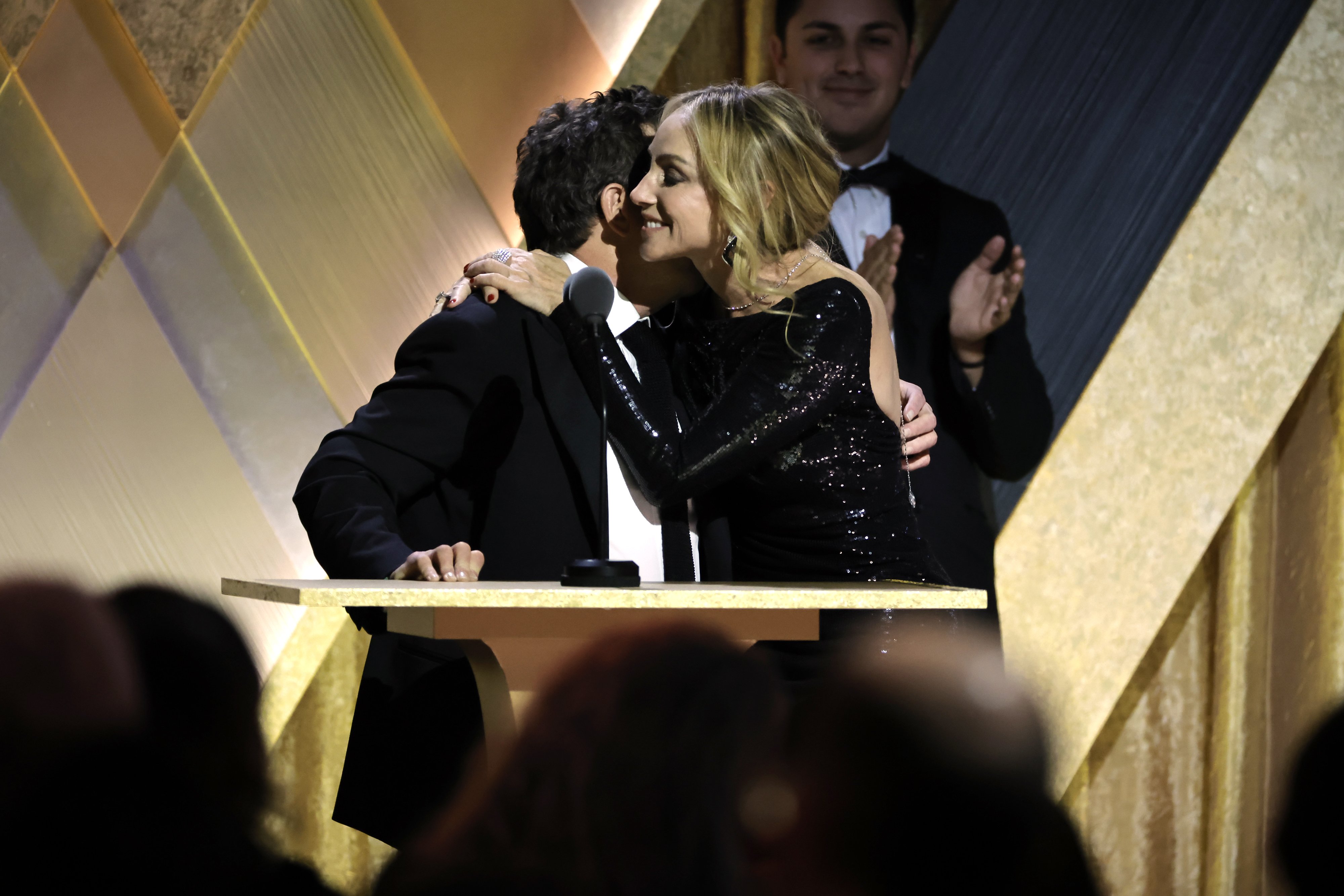 Michael J. Fox hugs his wife, Tracy Pollan onstage during the Academy of Motion Picture Arts and Sciences 13th Governors Awards at Fairmont Century Plaza on November 19, 2022, in Los Angeles, California. | Source: Getty Images