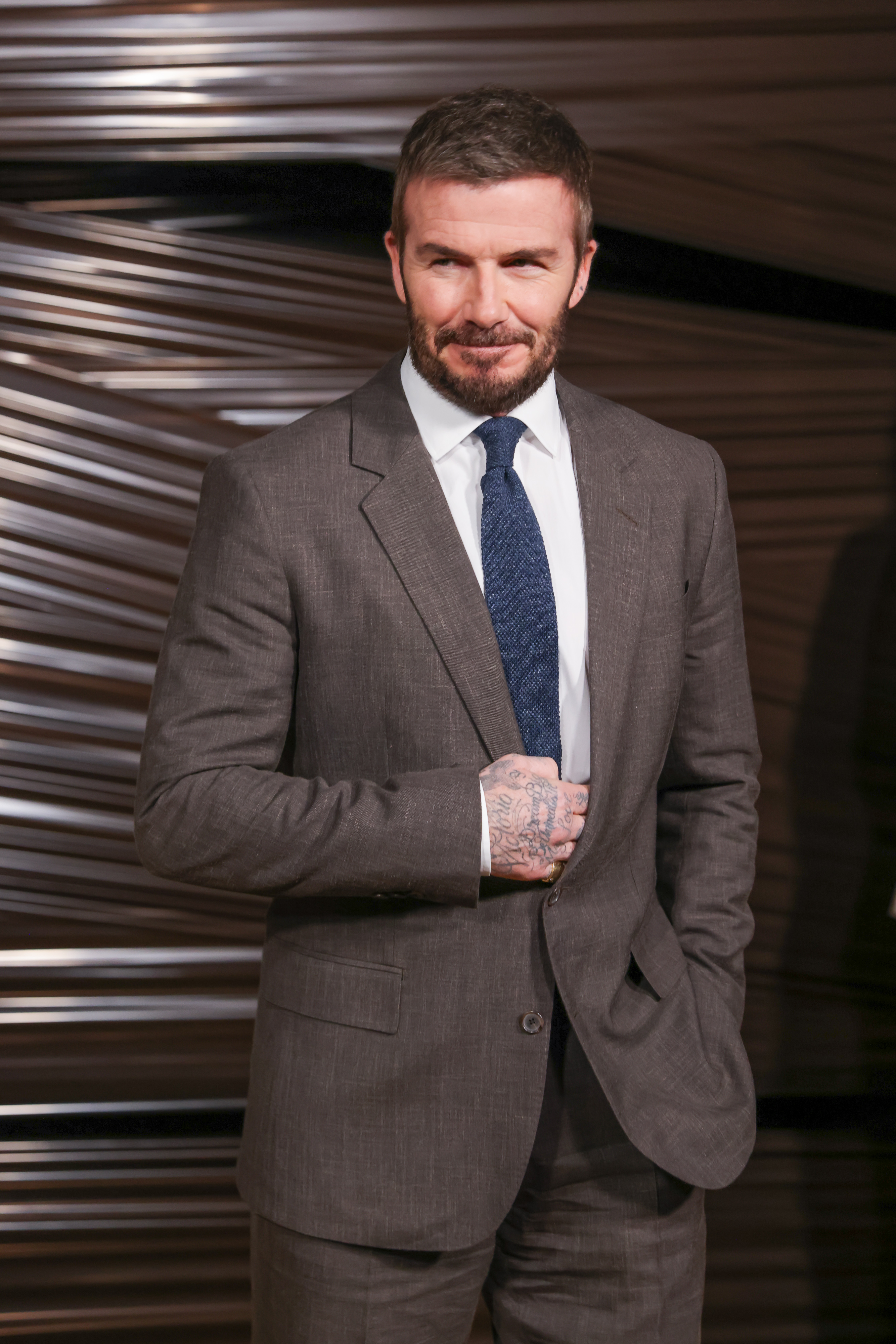 Sir David Beckham at the Boss fashion show during the Milan Menswear Fall/Winter 2026/2027 Fashion Week on 26 February 2026 in Italy. | Source: Getty Images