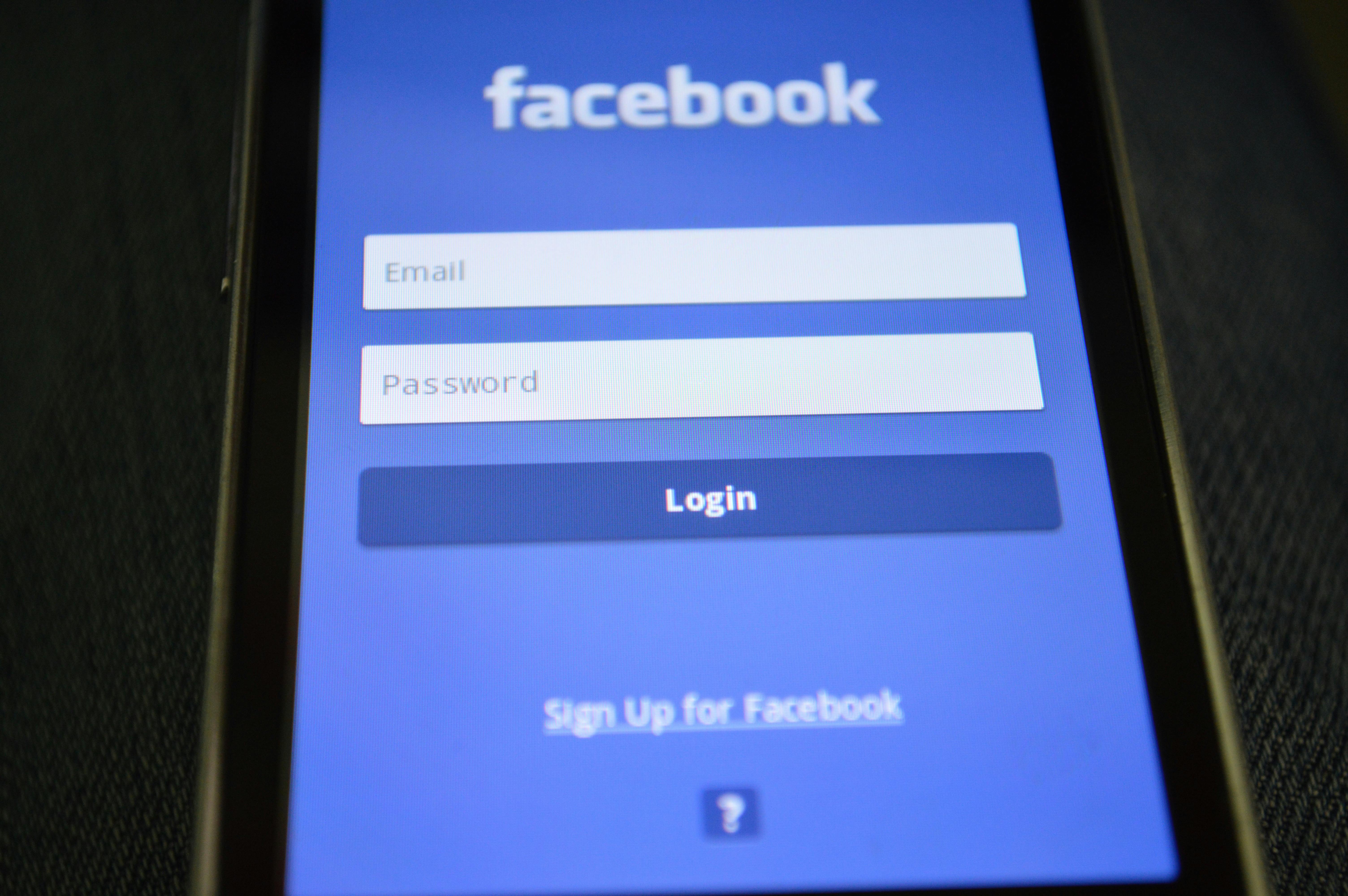 A phone opened to Facebook's log in screen | Source: Pexels