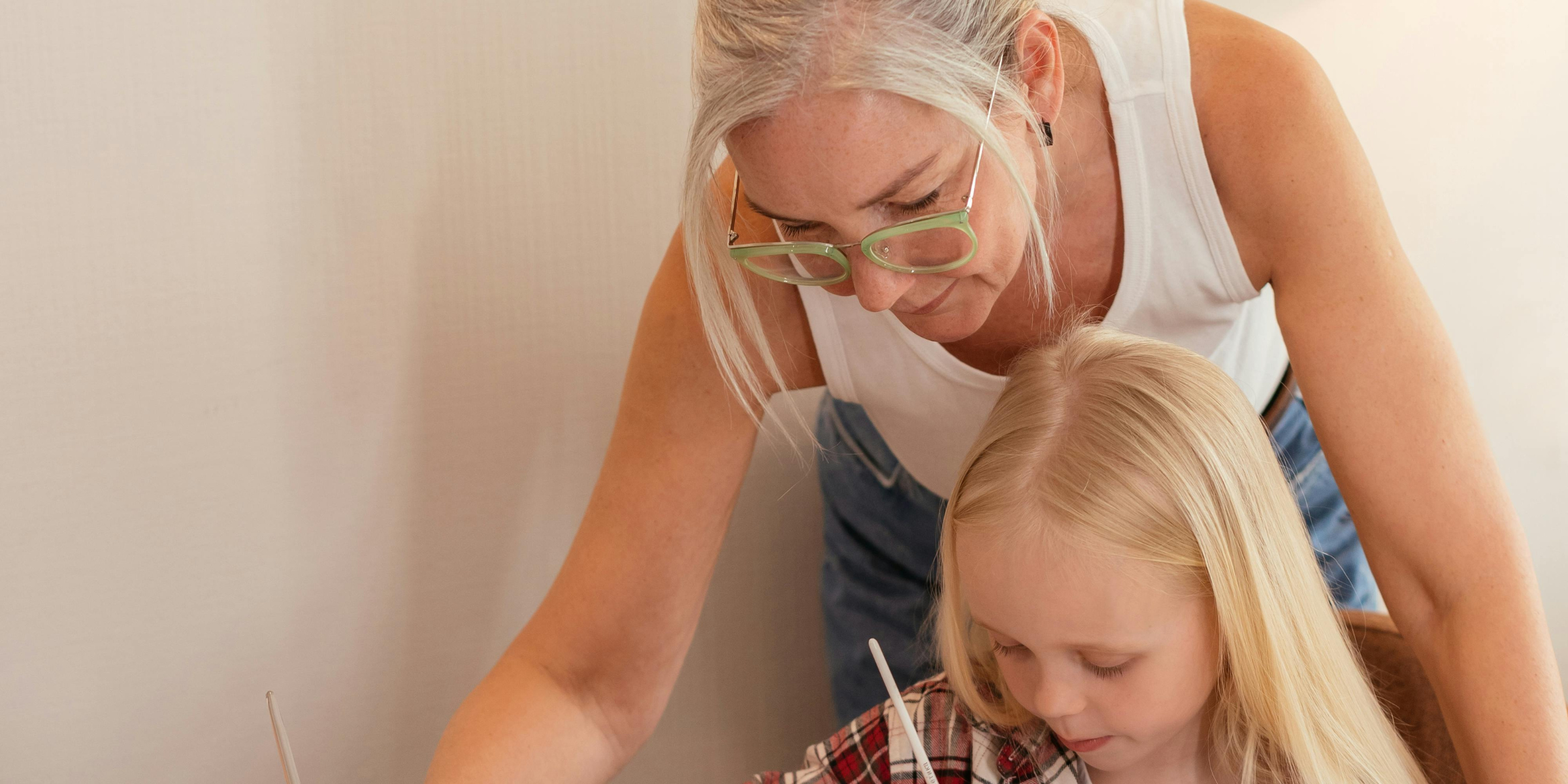 Woman and grandchild doing an activity together | Source: Pexels