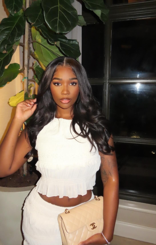 Ashly Robinson radiates quiet confidence in a crisp white set, the delicate ruffles adding softness to her sculpted silhouette. | Source: Instagram/ashleejenae