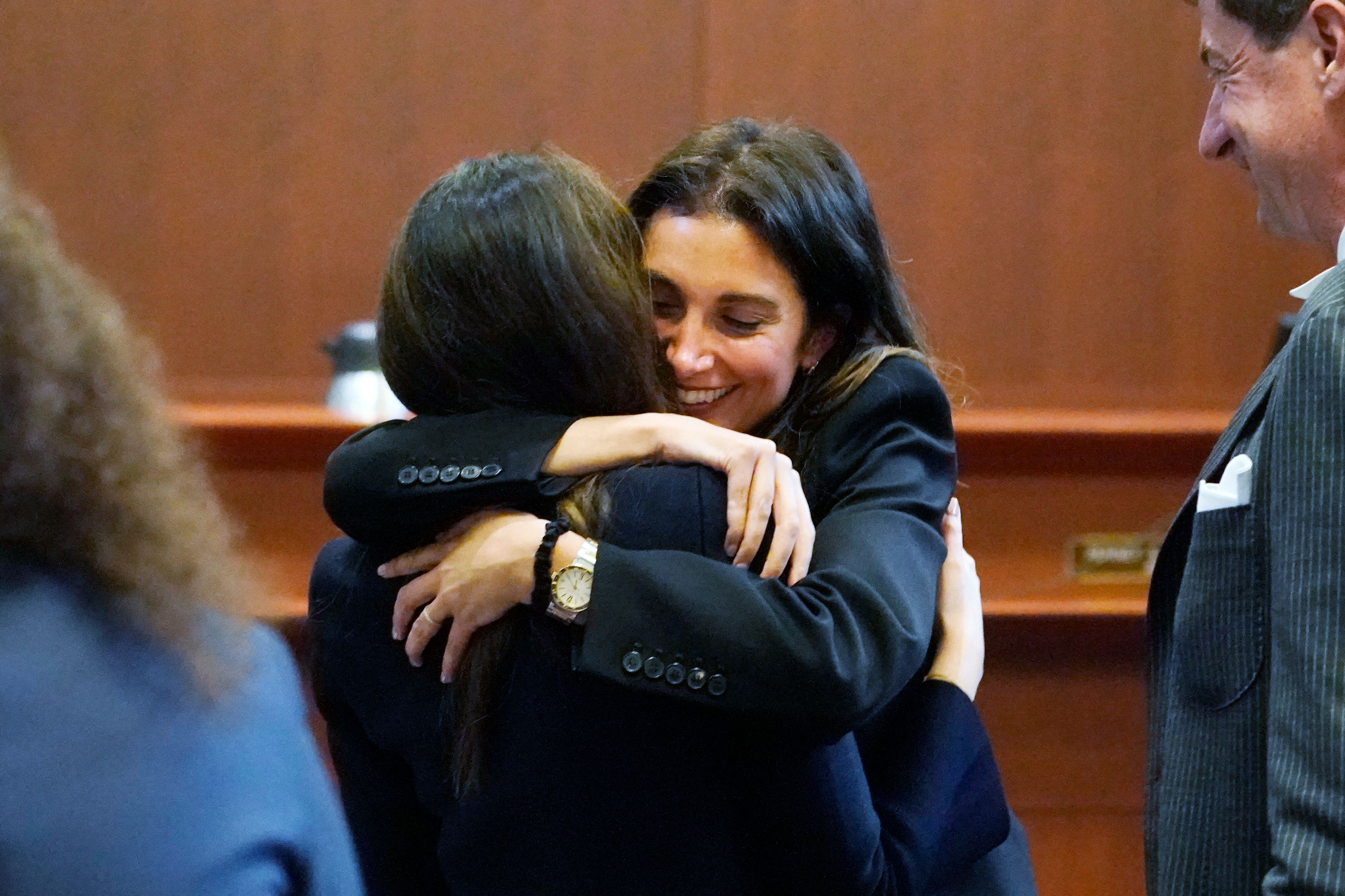 Lawyer Joelle Rich hugs attorney Camille Vasquez at the Fairfax County Circuit Courthouse on May 16, 2022, in Fairfax, Virginia. | Source: Getty Images