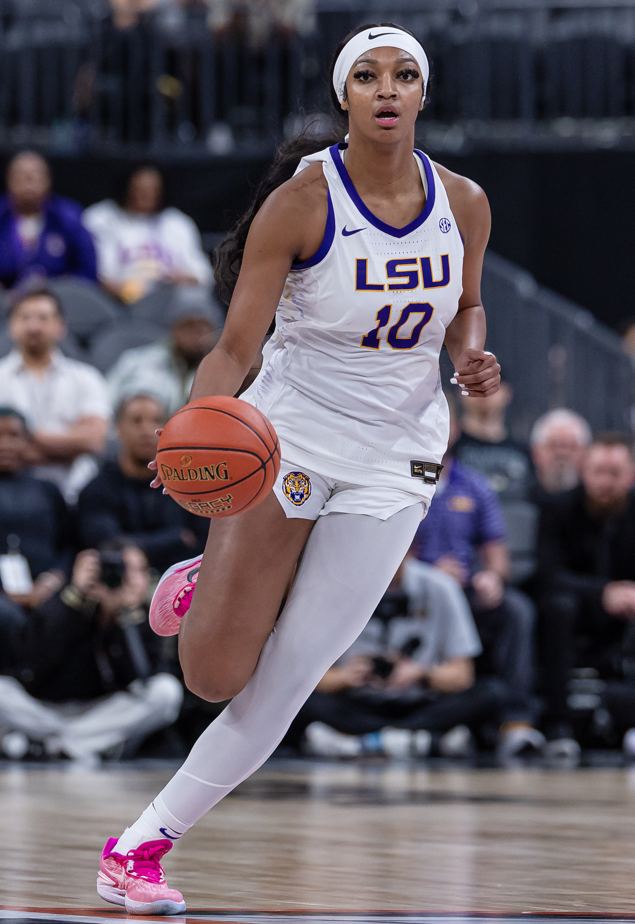 Angel Reese, #10 of the LSU Lady Tigers, brings the ball up court against the Colorado Buffaloes during the Naismith Hall of Fame Series at T-Mobile Arena on November 6, 2023, in Las Vegas, Nevada. | Source: Getty Images