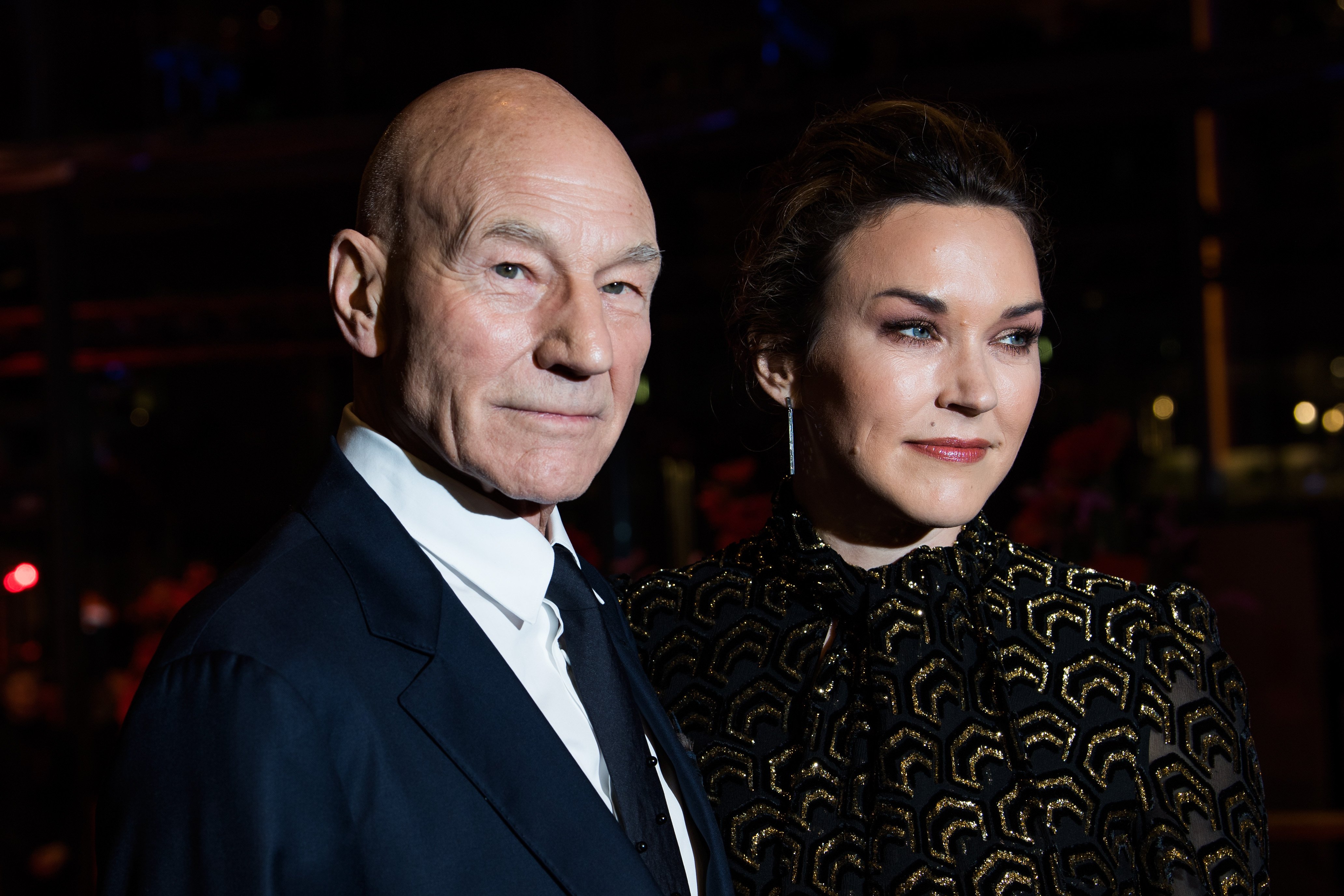 Patrick Stewart and Sunny Ozel at the 67th Berlinale International Film Festival premiere of 'Logan' in 2017 in Berlin, Germany. | Source: Getty Images