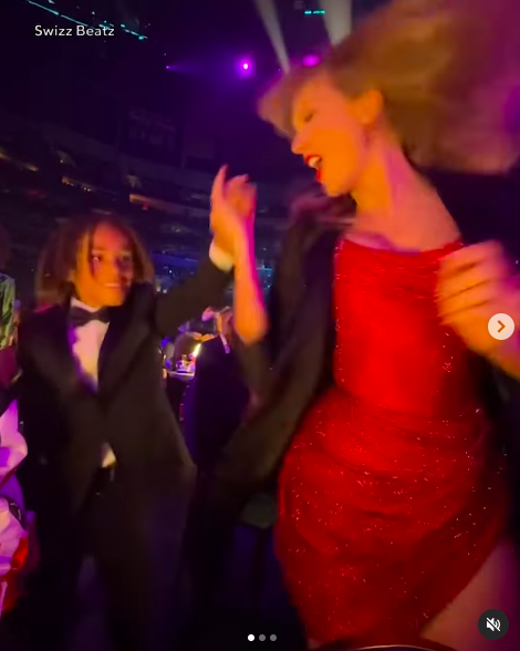 Taylor Swift spinning around amid dancing with Genesis Dean. | Source: Instagram/entertainmenttonight