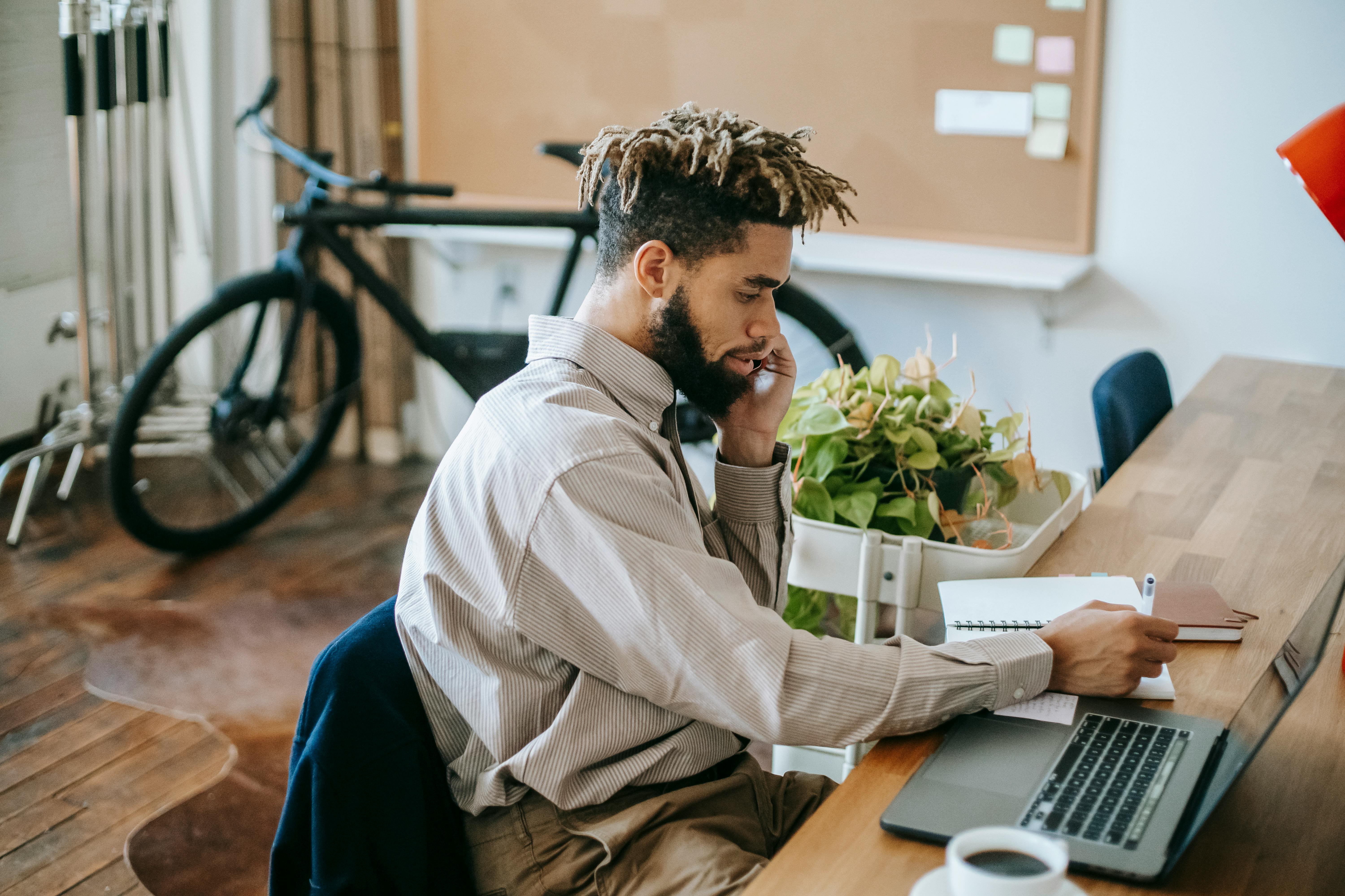 A man on call at work | Source: Pexels