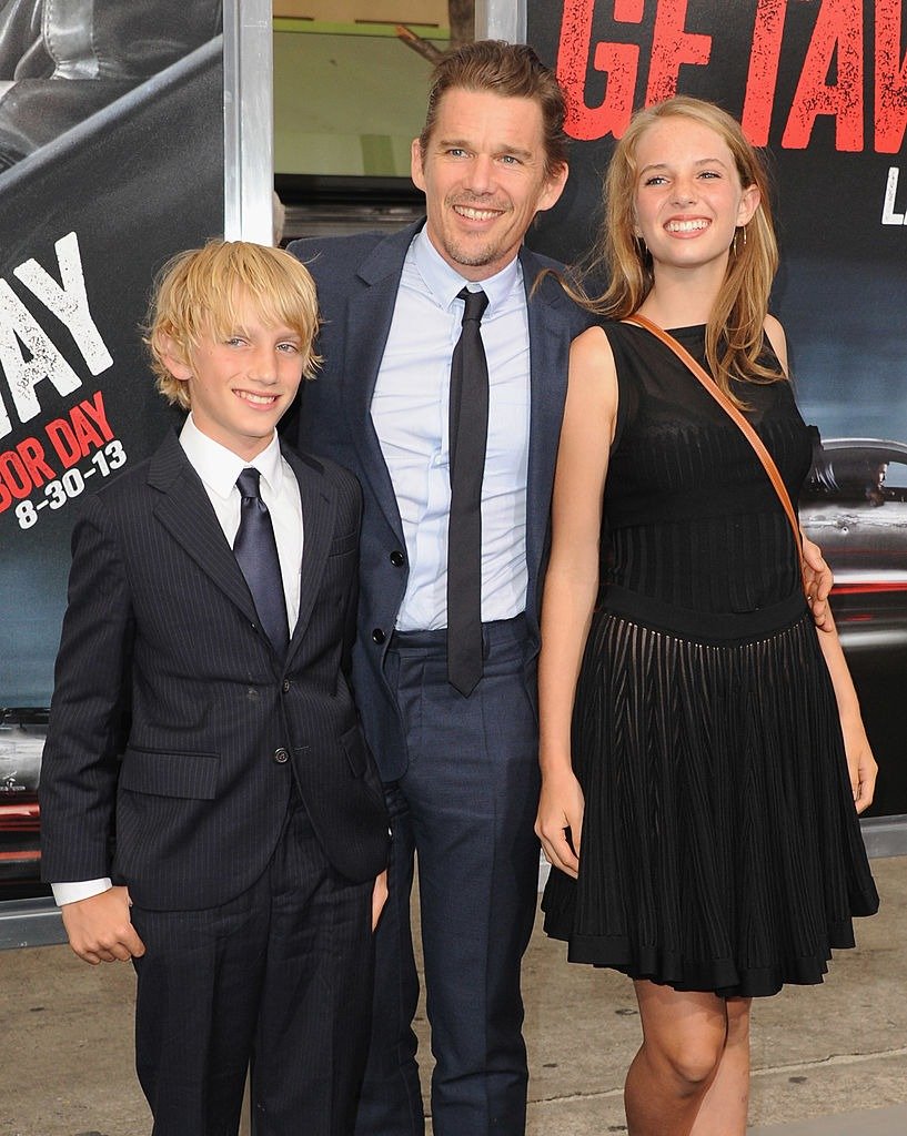 Ethan Hawke and son Roan Thurman-Hawke and daughter Maya Thurman-Hawke attend the Los Angeles Premiere "Getaway" at Regency Village Theatre on August 26, 2013. | Photo: Getty Images