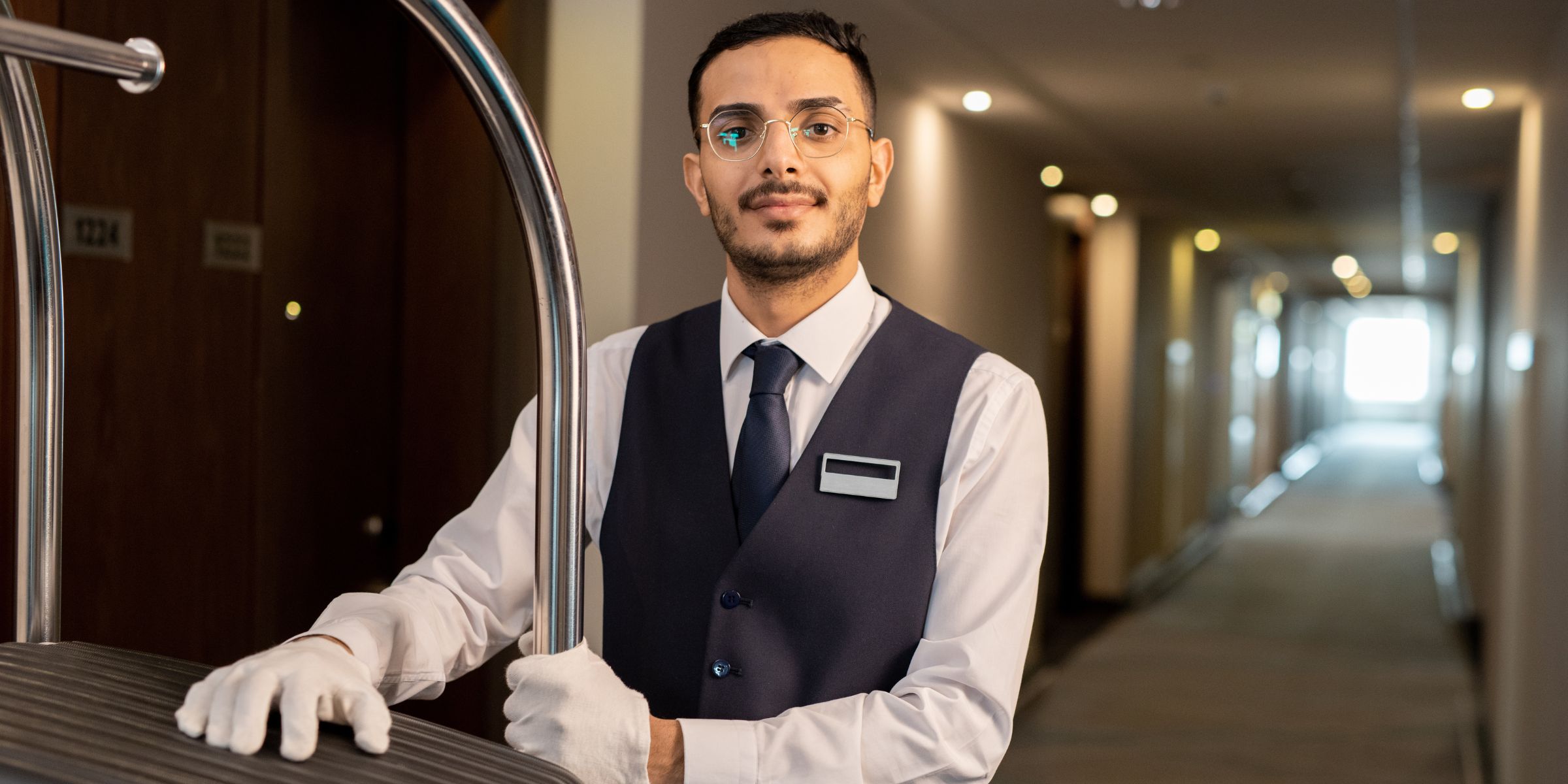 A young doorman and porter | Source: Shutterstock