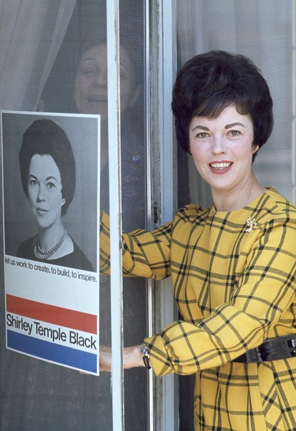 Shirley Temple with a poster from her United States House of Representatives election campaign as Shirley Temple Black, USA, 1968 | Source: Getty Images