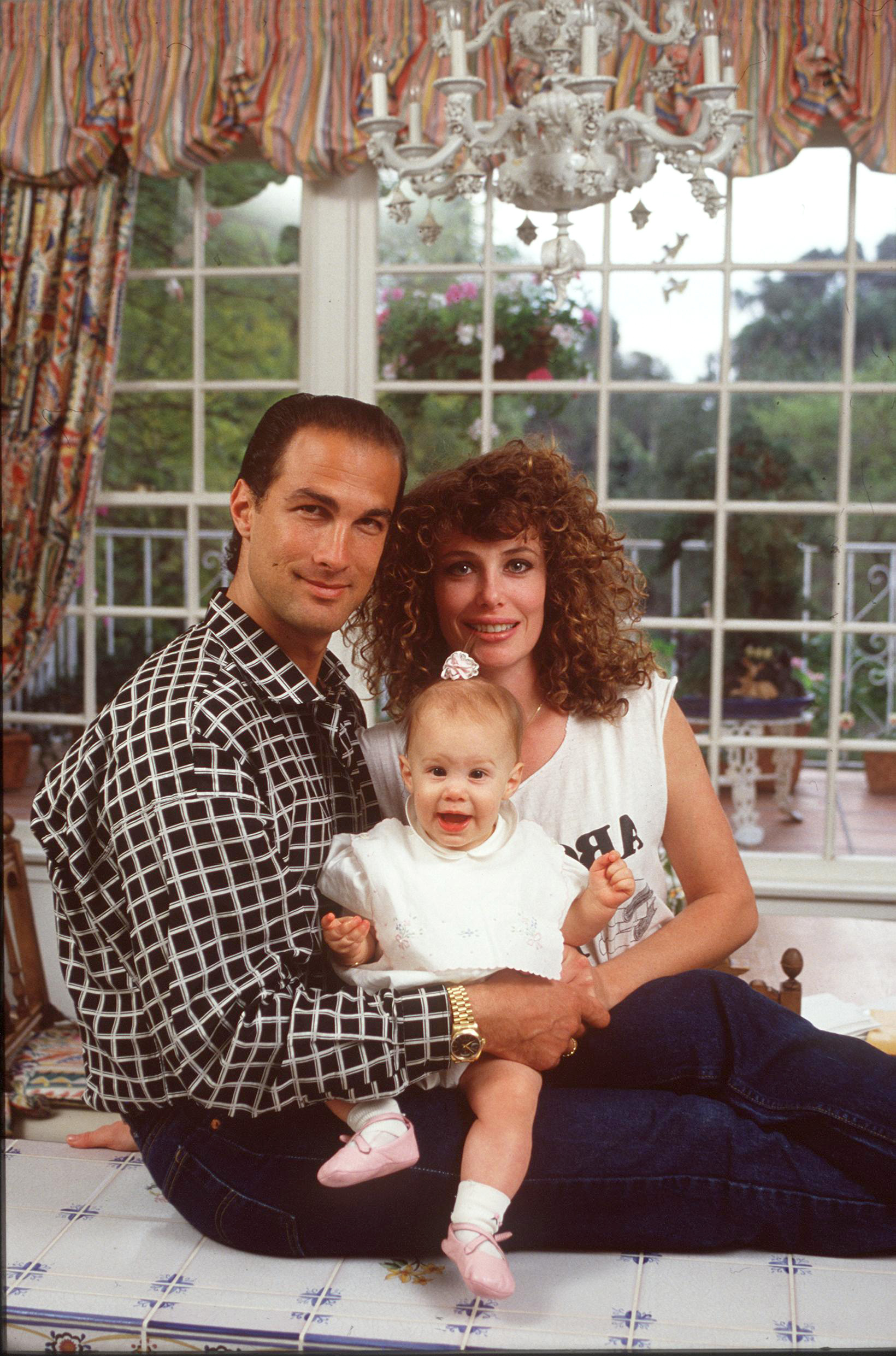 Steven Seagal and Kelly LeBrock with their first child in Bevely Hills, California, on April 13, 1989 | Source: Getty Images