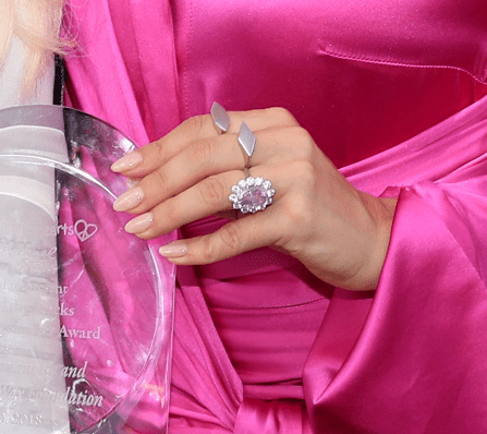 A close-up of Lady Gaga's gorgeous pink sapphire engagement ring from the Children Mending Hearts' 10th Annual Empathy Rocks, 2018, California. | Photo: Getty Images