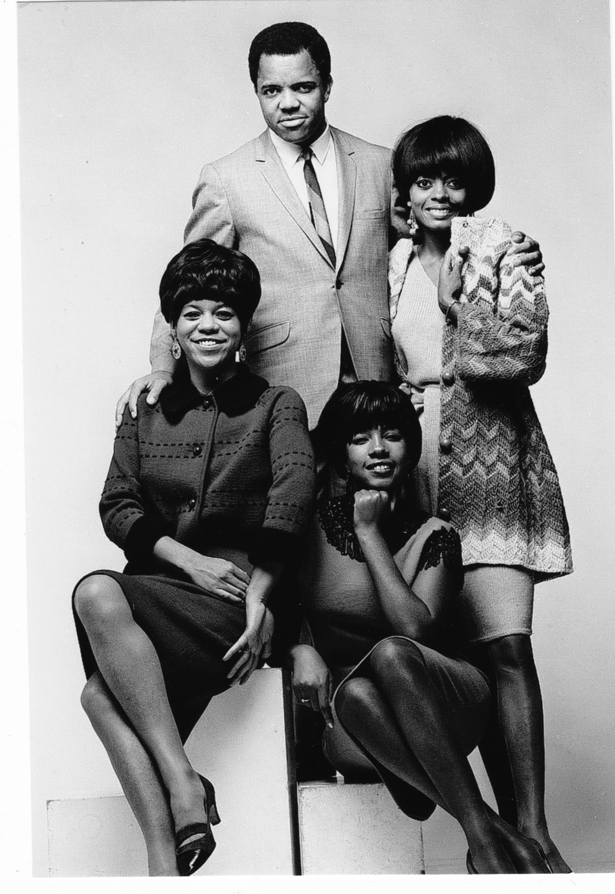 Berry Gordy, Diana Ross, Mary Wilson, and Florence Ballard pose for a studio portrait in 1965 | Source: Getty Images