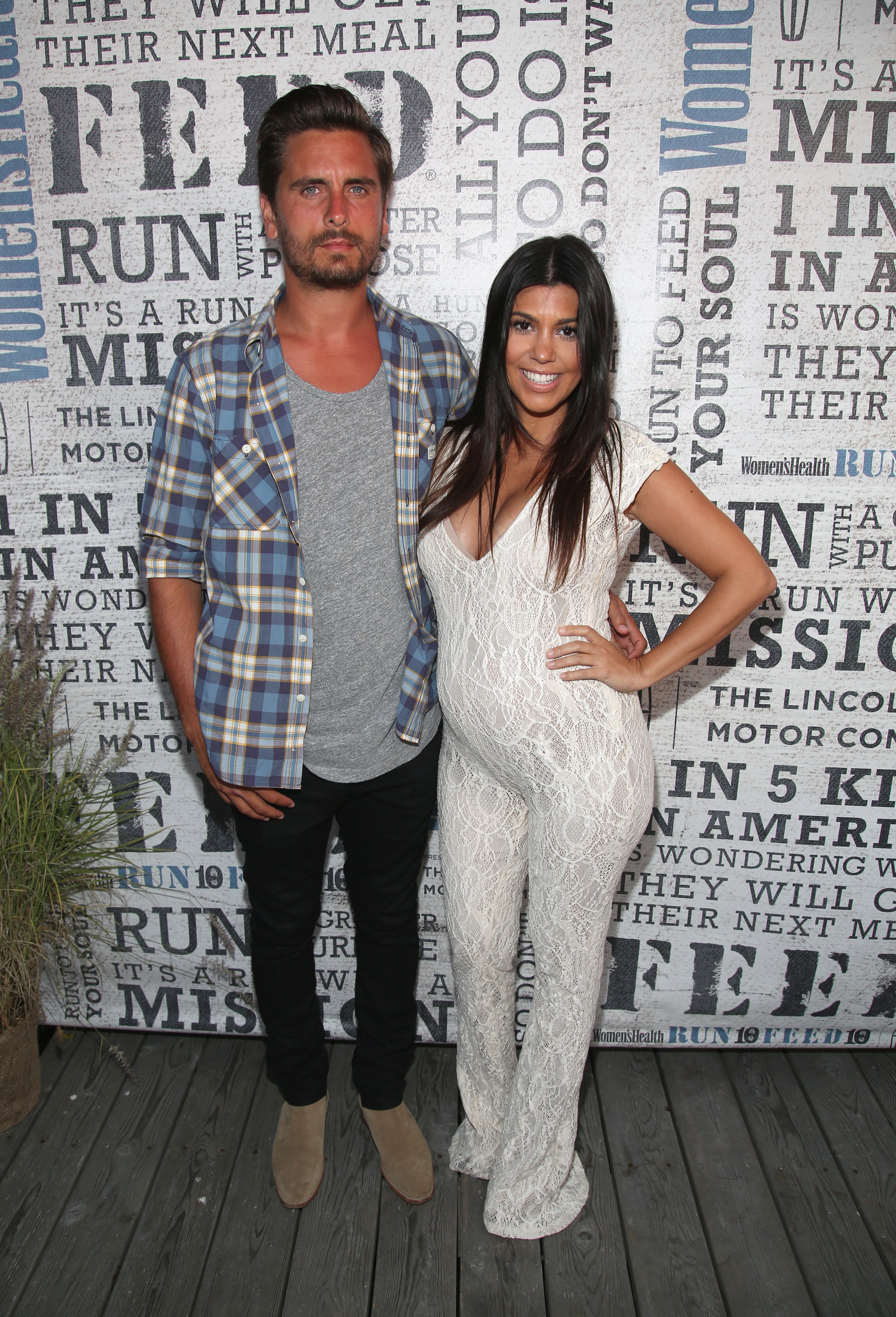 TV Personality Kourtney Kardashian and then-boyfriend Scott Disick attend Women's Health Hosts Hamptons "Party Under The Stars" for RUN10 FEED10 at Bridgehampton Tennis and Surf Club on August 9, 2014 in Bridgehampton, New York | Source: Getty Images