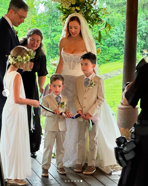 Ian Hock and Eva Amurri with Marlowe Mae, Major James, and Mateo Antoni Martino participating in the handfasting tradition, posted on July 1, 2024 | Source: Instagram/marcus.mcgregor
