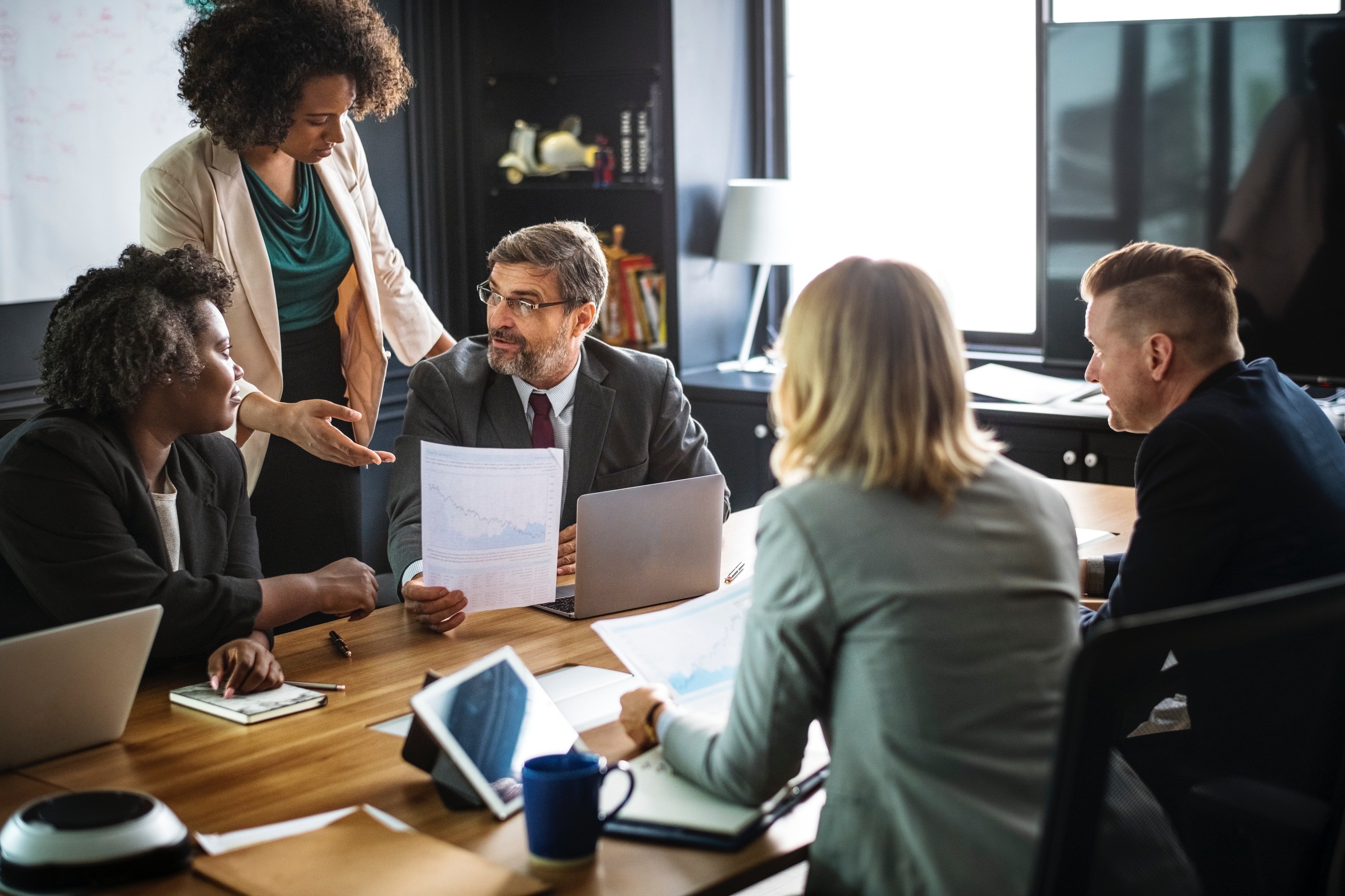 Staff in a meeting. | Source: Pexels