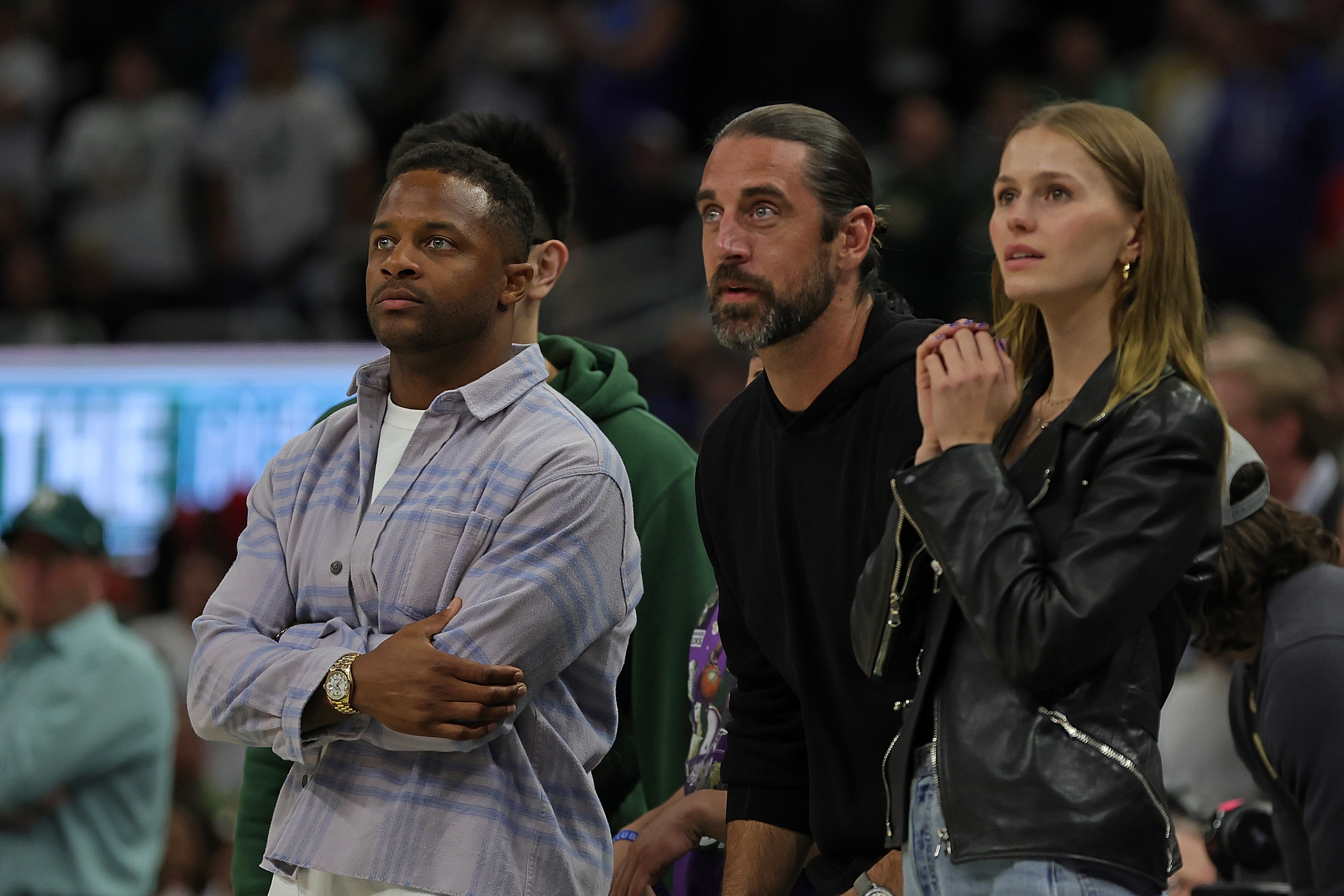 Randall Cobb, Aaron Rodgers and Mallory Edens attend a basketball game on April 20, 2022, in Milwaukee, Wisconsin. | Source: Getty Images