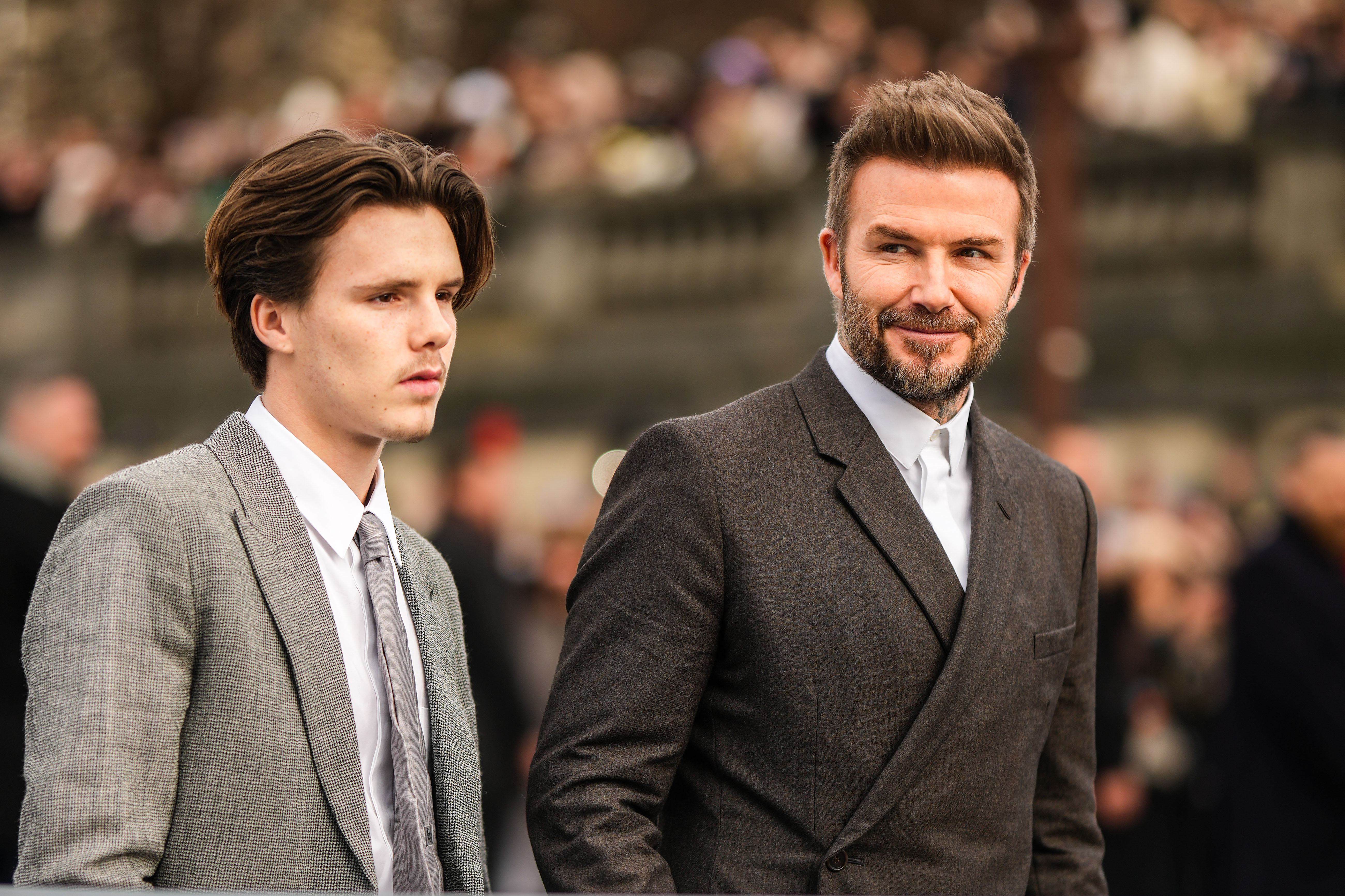 Cruz Beckham and David Beckham attending Paris Fashion Week on January 20, 2023 | Source: Getty Images