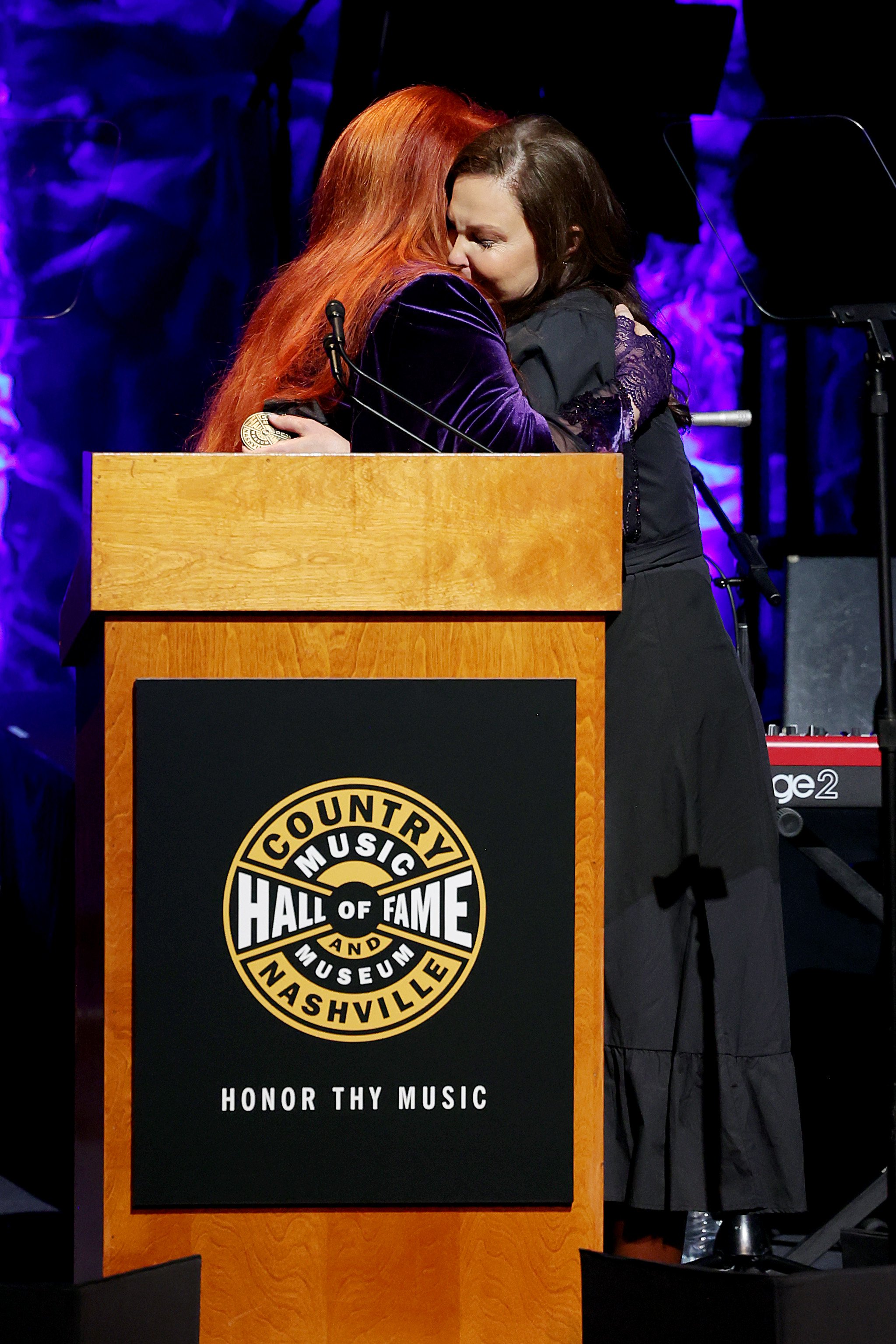 Inductee Wynonna Judd and Ashley Judd speak onstage for the class of 2021 medallion ceremony at Country Music Hall of Fame and Museum on May 01, 2022 in Nashville, Tennessee. | Source: Getty Images