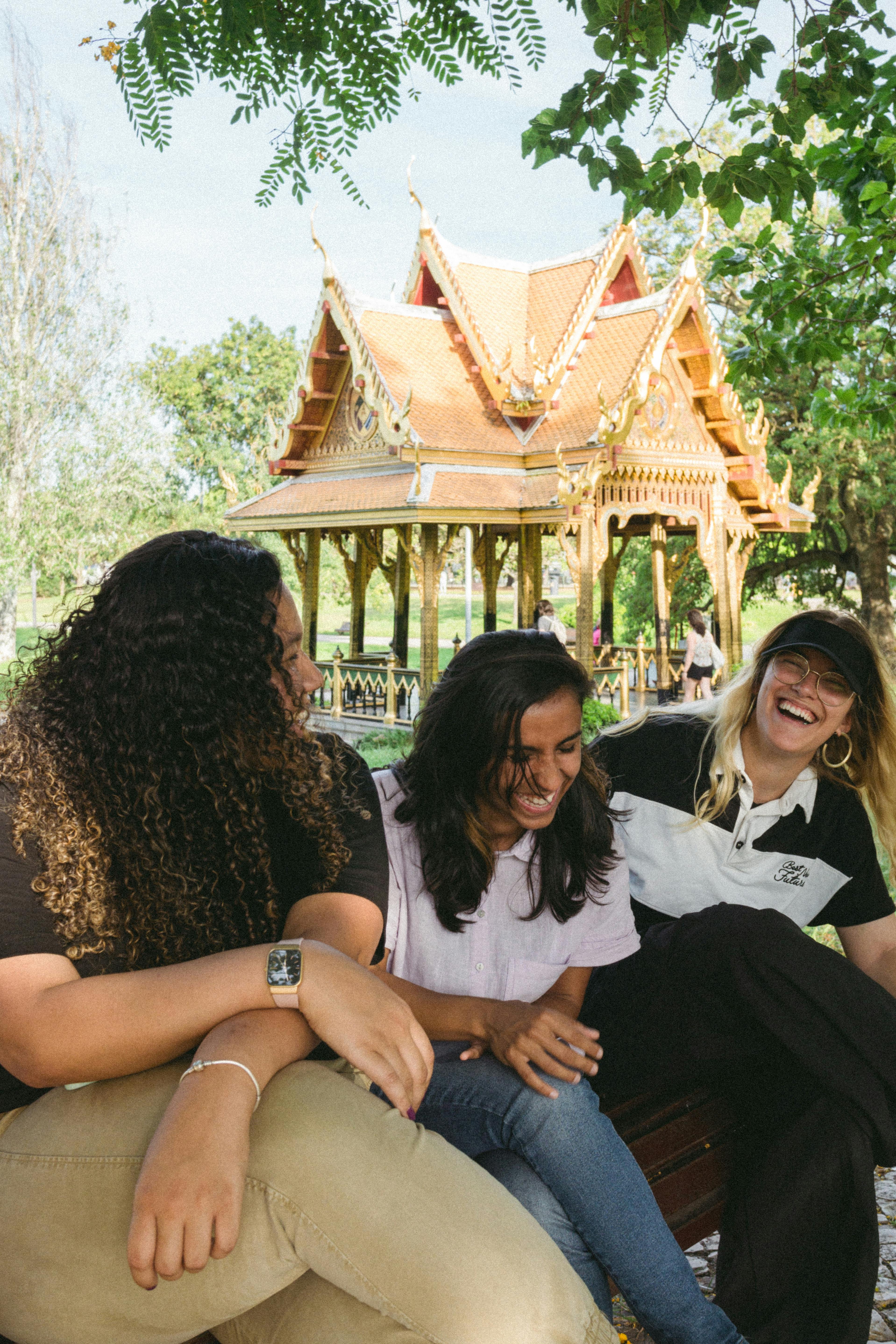 A woman laughing with her friends | Source: Pexels