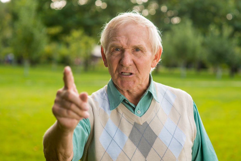 Angry grandfather threatens younger person. | Photo: Shutterstock.