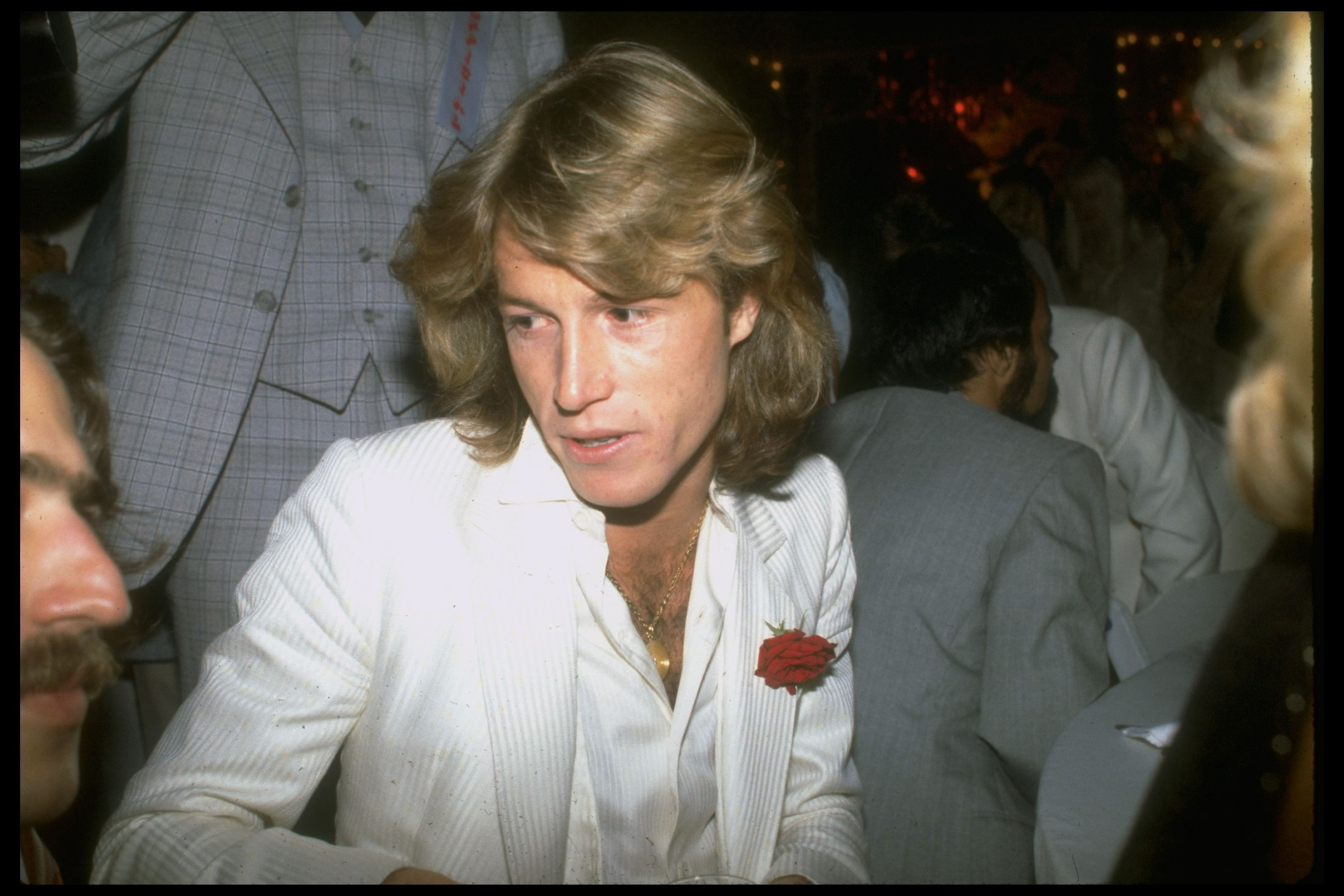 Andy Gibb photographed among other people, circa 1978 | Source: Getty Images