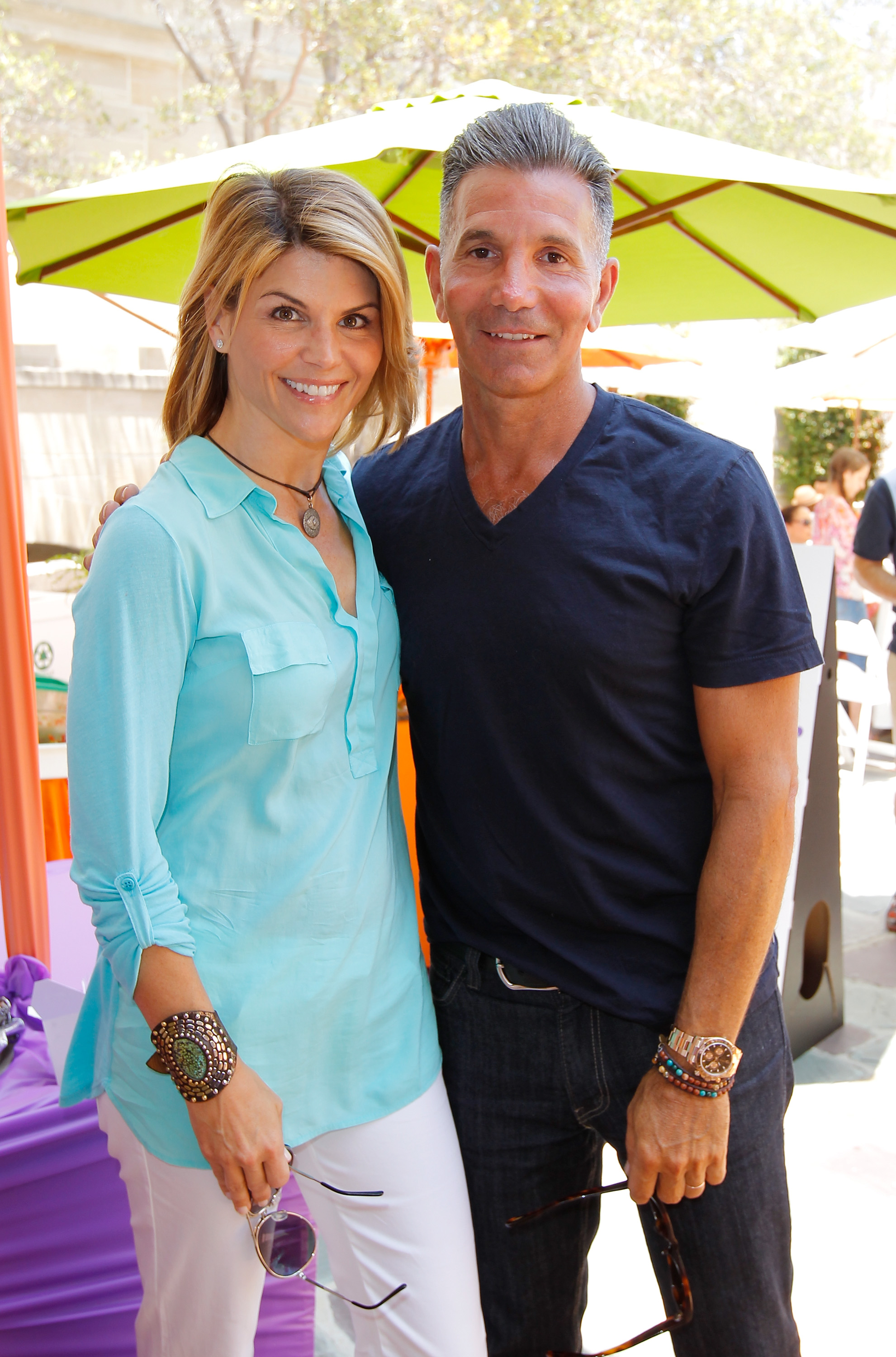 Lori Loughlin and Mossimo Giannulli attend the 6th Annual Kidstock Music and Arts Festival at Greystone Mansion in Beverly Hills on June 3, 2012 | Source: Getty Images