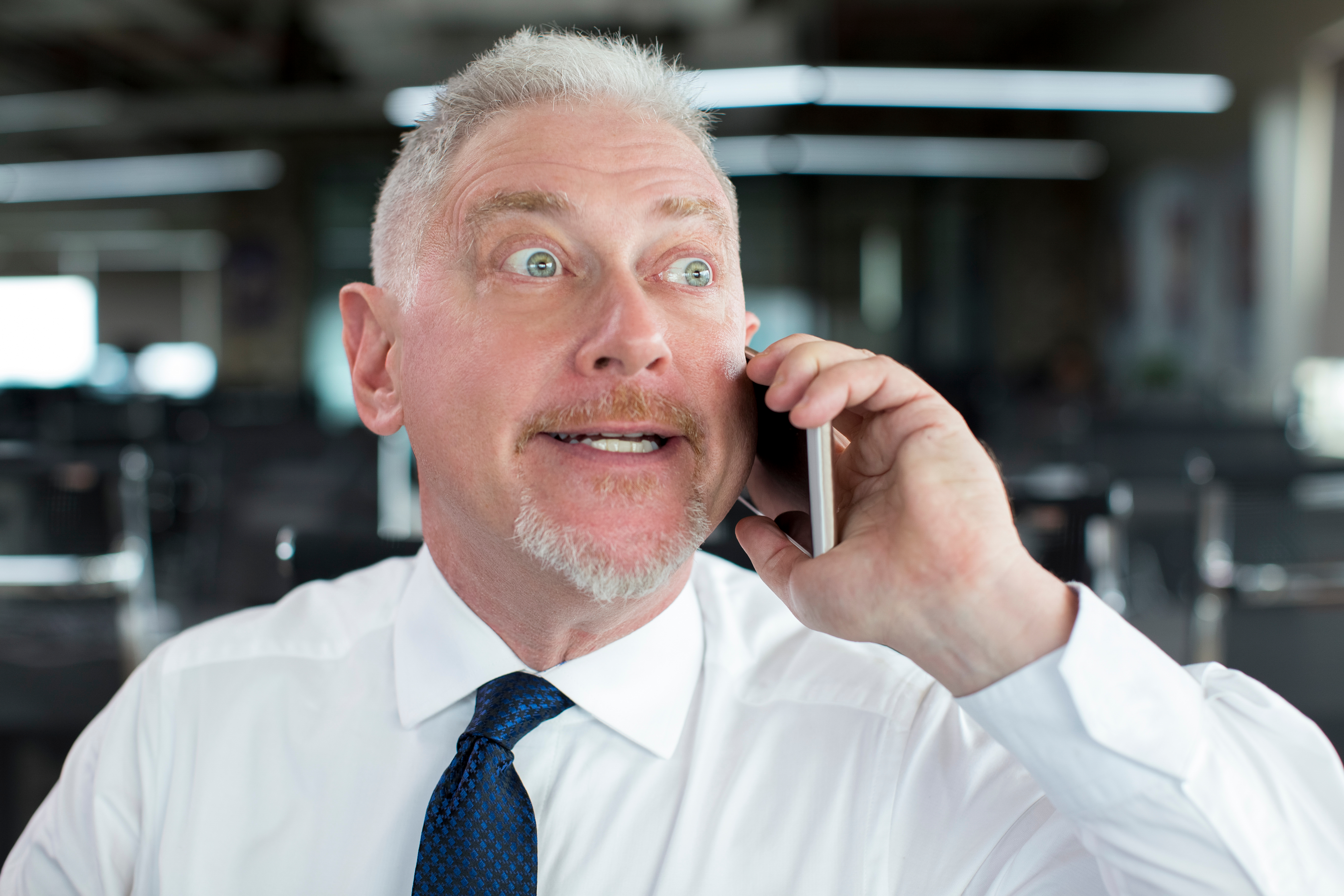 A man expressing anger on the phone | Source: Shutterstock