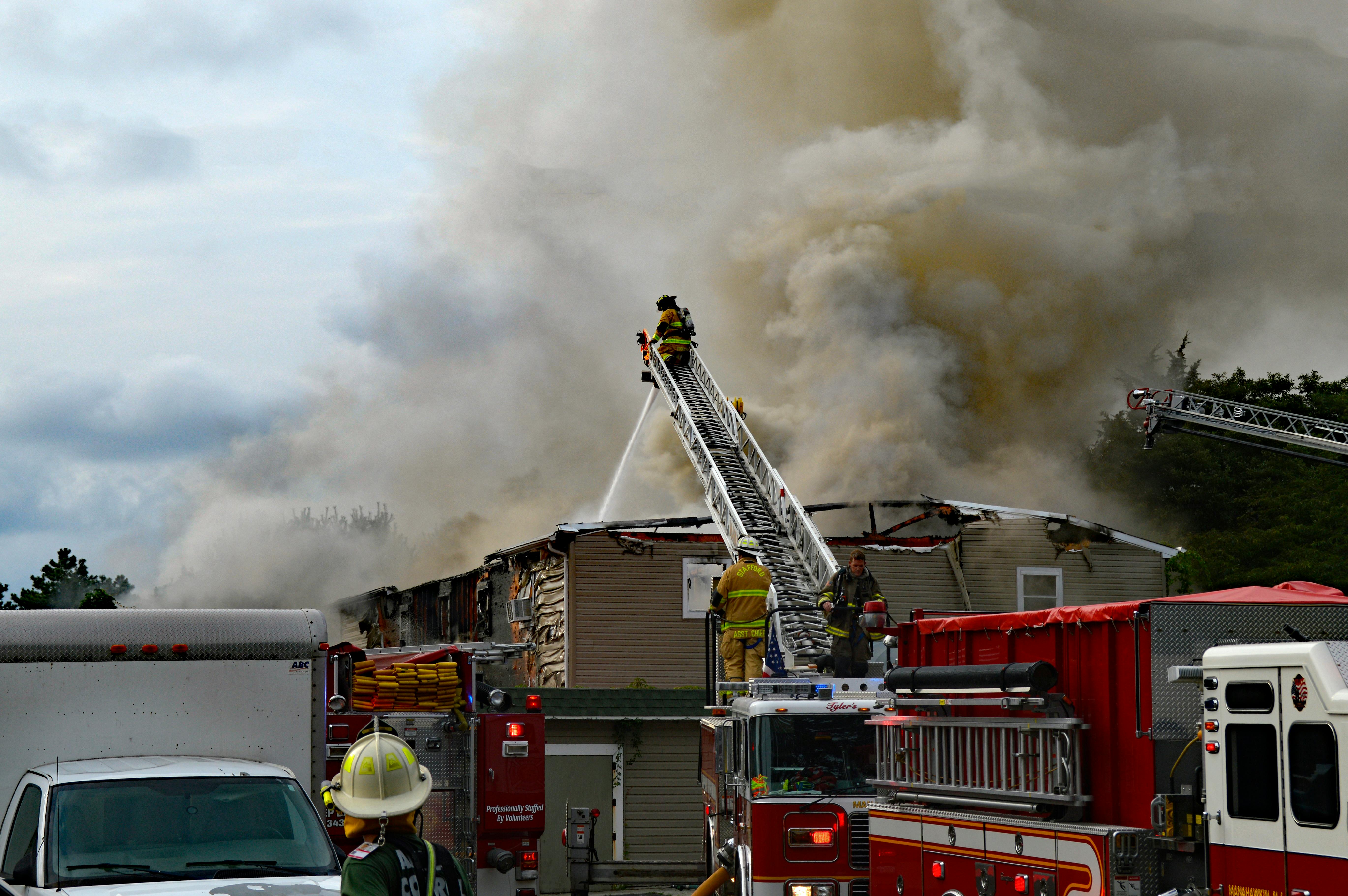 Firemen extinguish a fire | Source: Pexels