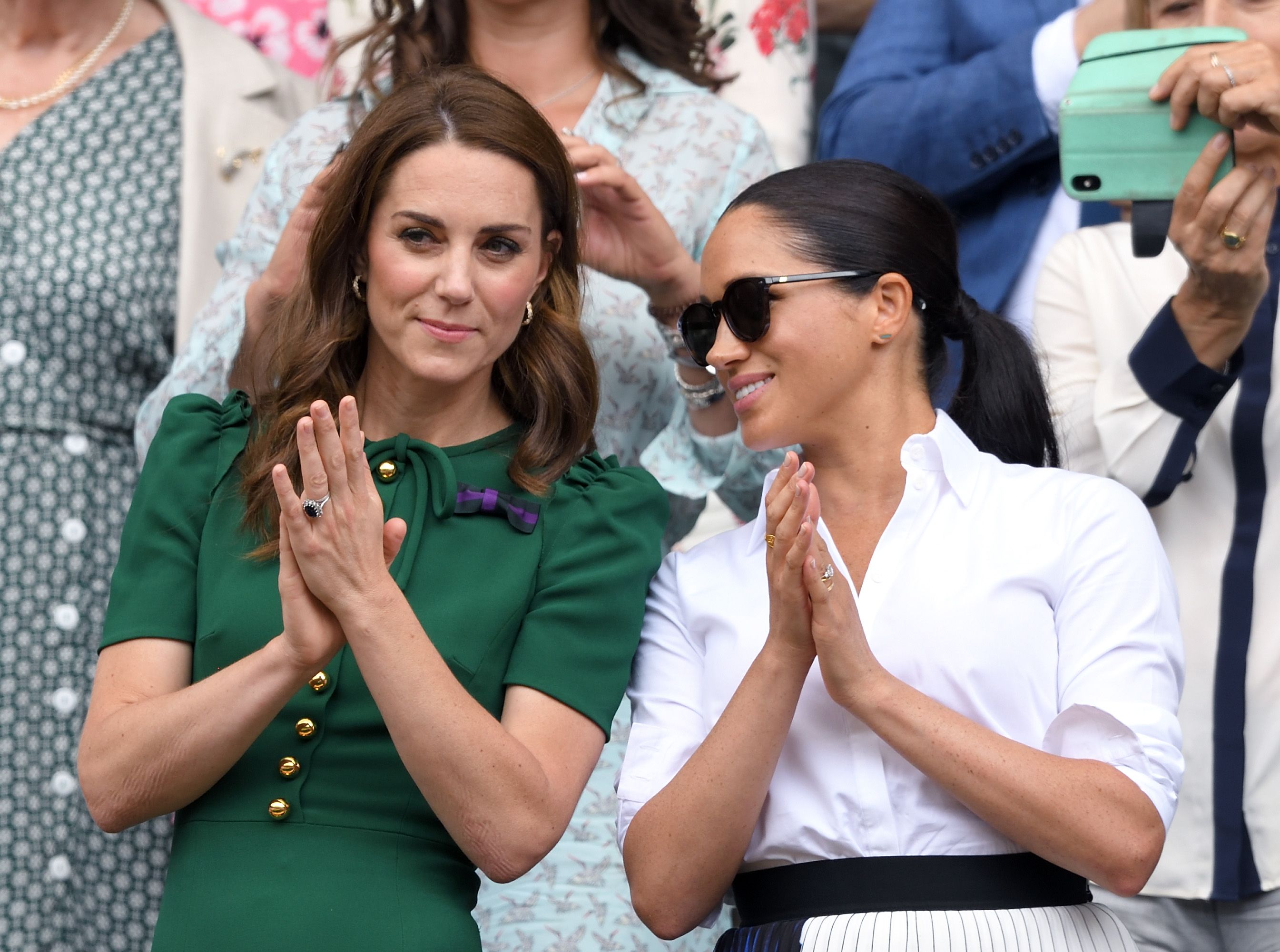 Kate Middleton and Meghan Markle in the Royal Box at day twelve of the Wimbledon Tennis Championships at All England Lawn Tennis and Croquet Club on July 13, 2019 | Photo: Getty Images