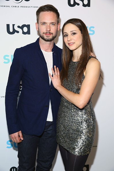 Patrick J. Adams and actress Troian Bellisario attend the Patrick J. Adams Exhibition Opening of 'SUITS' Gallery at 402 West 13th Street on January 22, 2015, in New York City. | Source: Getty Images.