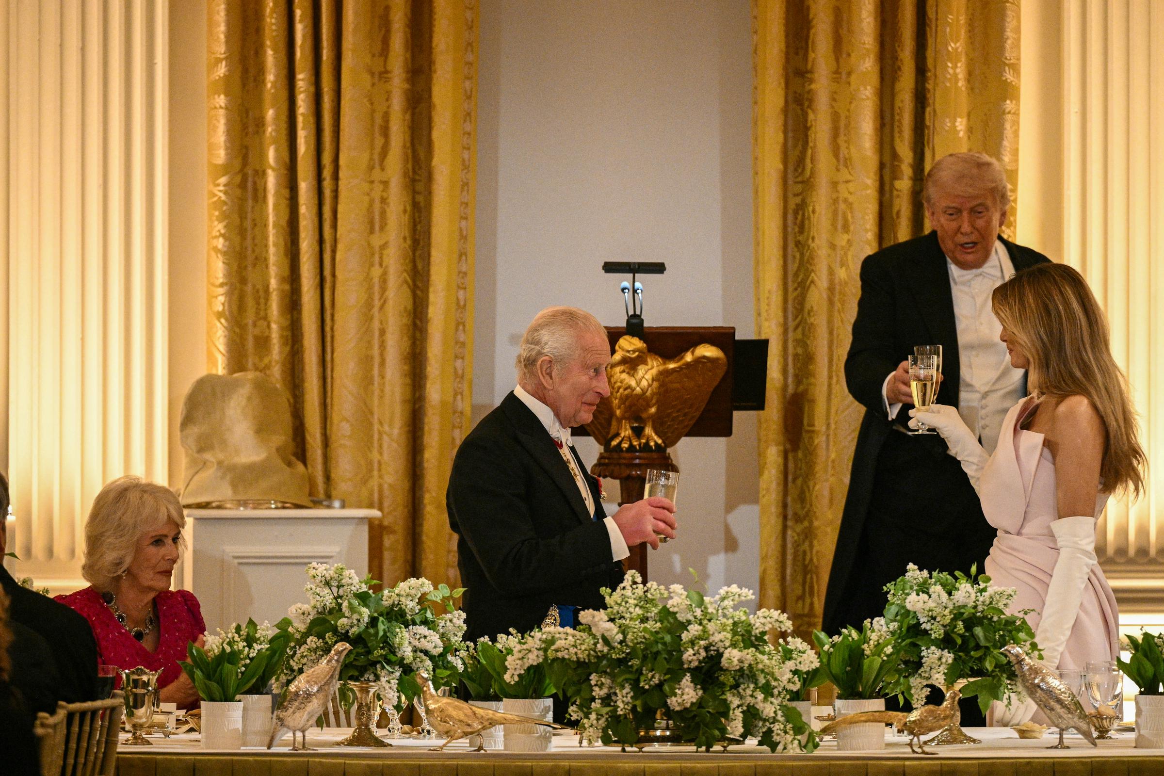 King Charles III toasts with Donald Trump and Melania Trump as Queen Camilla looks on during a State Dinner in the White House East Room, April 28, 2026. | Source: Getty Images
