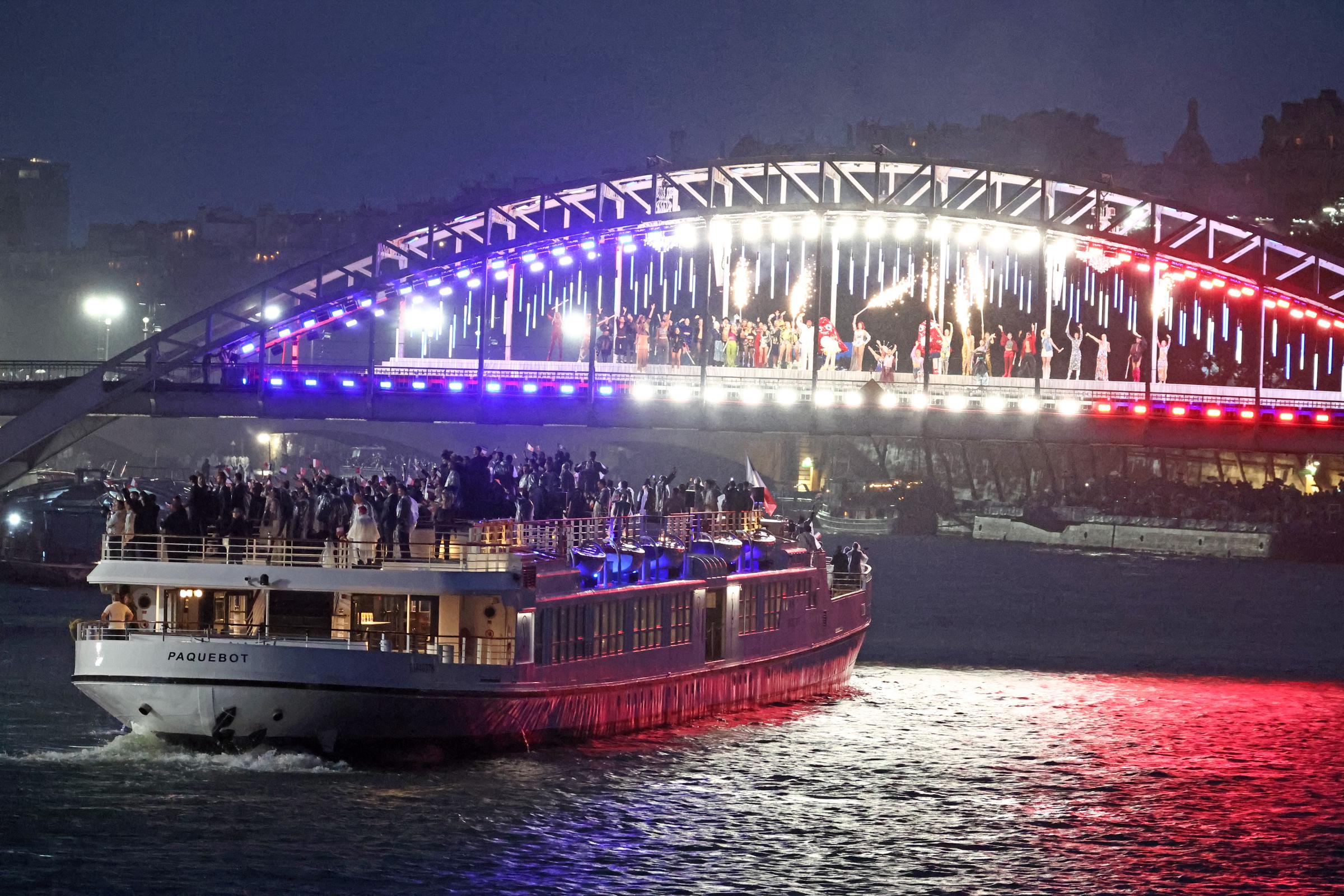 A boats carries members of a delegation along the Seine river during the opening ceremony of the Olympic Games Paris 2024 in Paris, France, on July 26, 2024. | Source: Getty Images