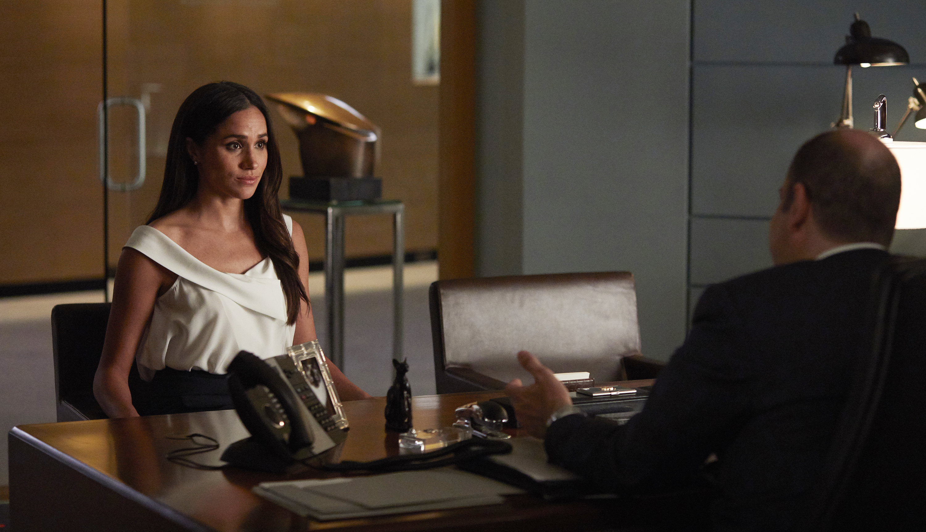 Meghan Markle as Rachel Zane and Rick Hoffman as Louis Litt on "Suits" on June 7, 2017. | Source: Getty Images