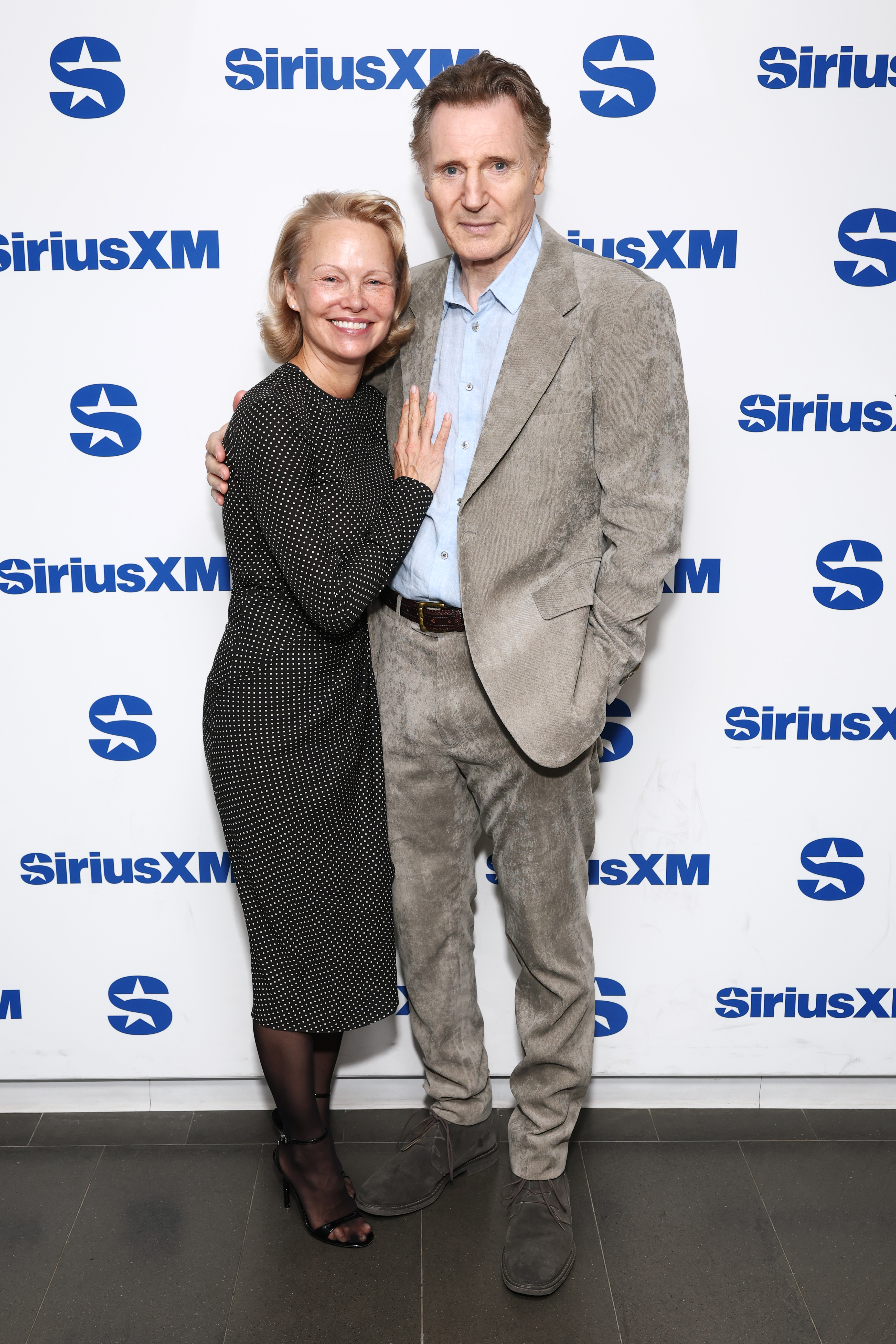 Pamela Anderson and Liam Neeson attend SiriusXM's Town Hall with the cast of "The Naked Gun" hosted by Andy Cohen at SiriusXM Studios on July 30, 2025, in New York City. | Source: Getty Images