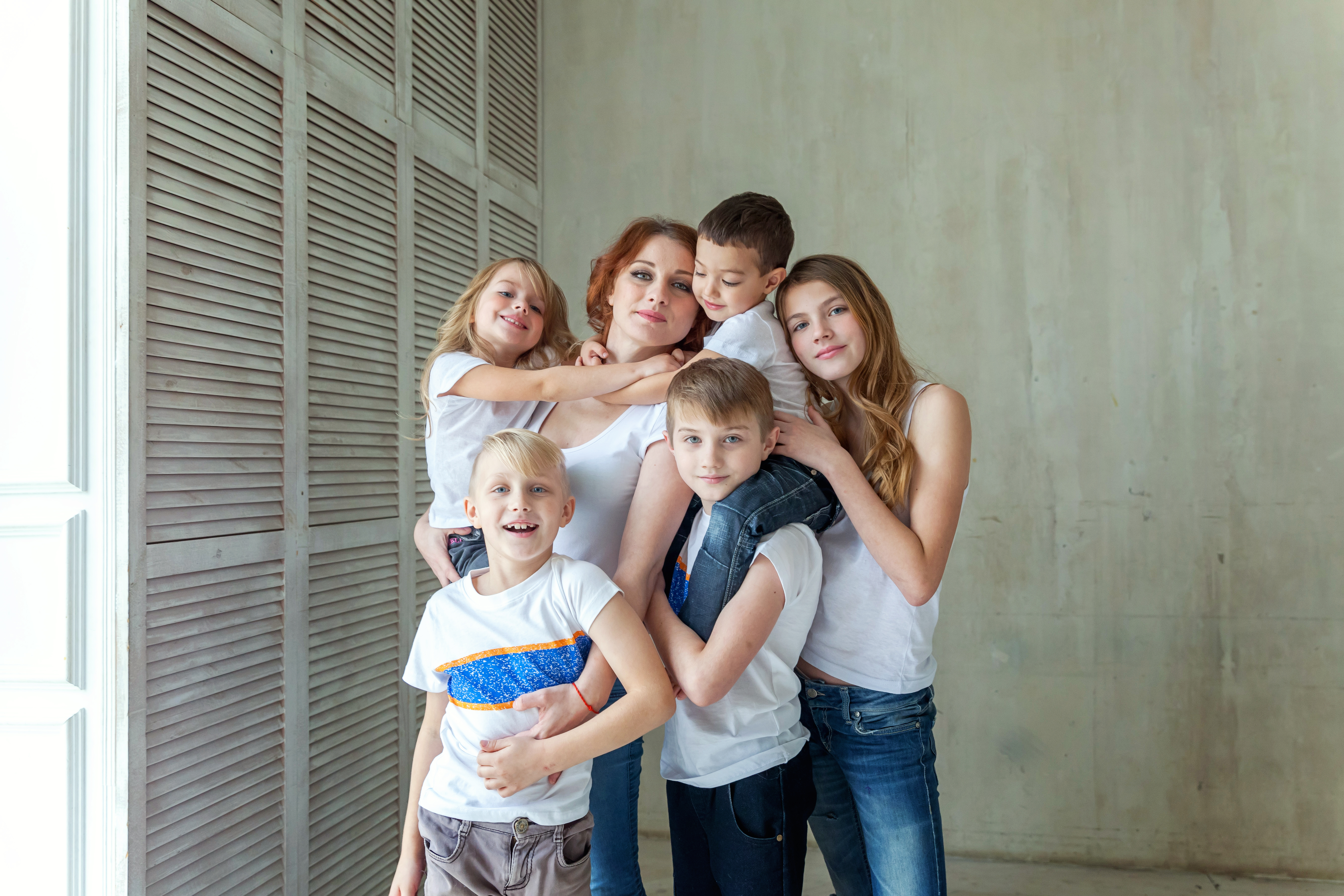 A happy mother with five children | Source: Shutterstock
