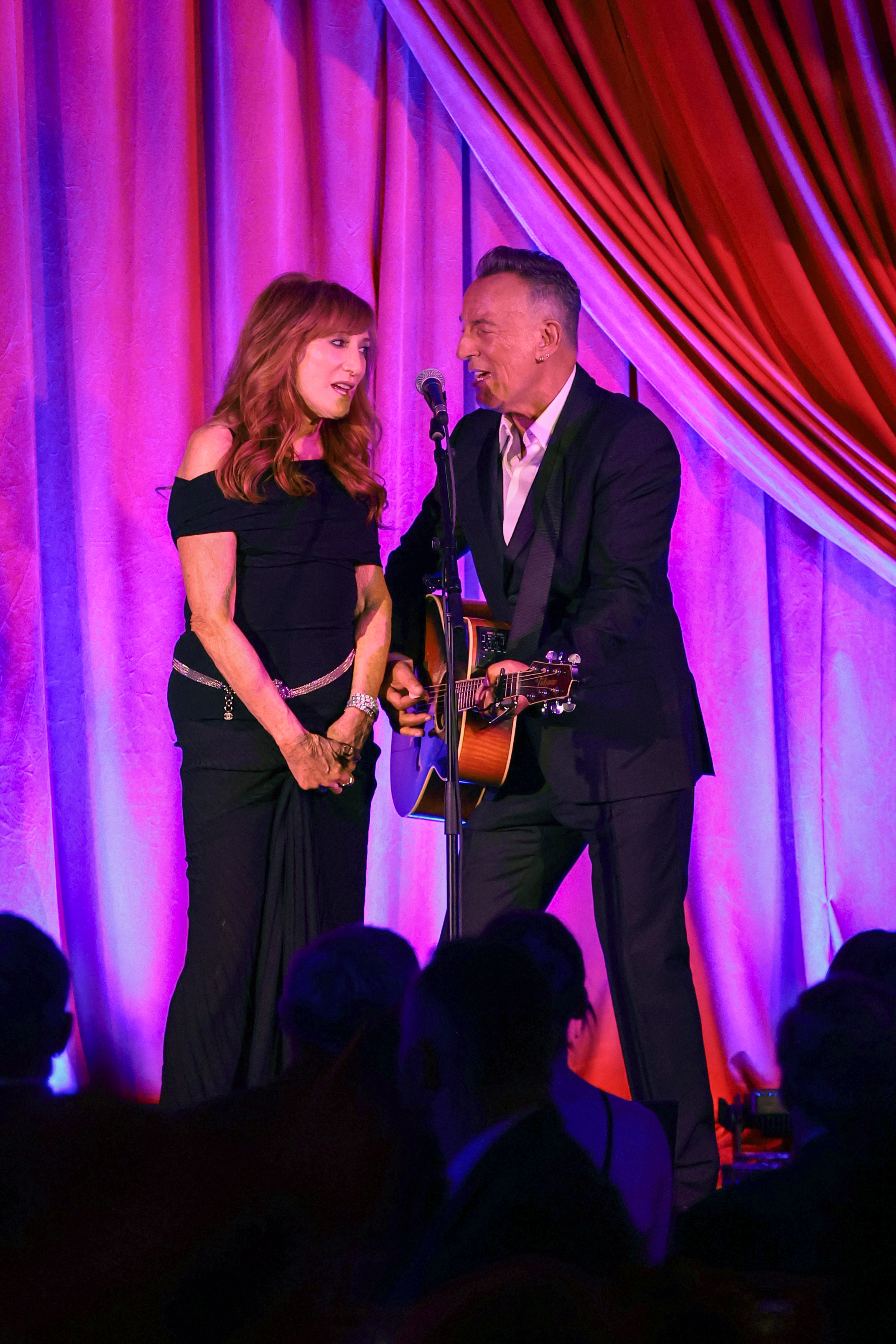 Patti Scialfa and Bruce Springsteen performing at the Clooney Foundation For Justice Inaugural Albie Awards in New York City on September 29, 2022 | Source: Getty Images