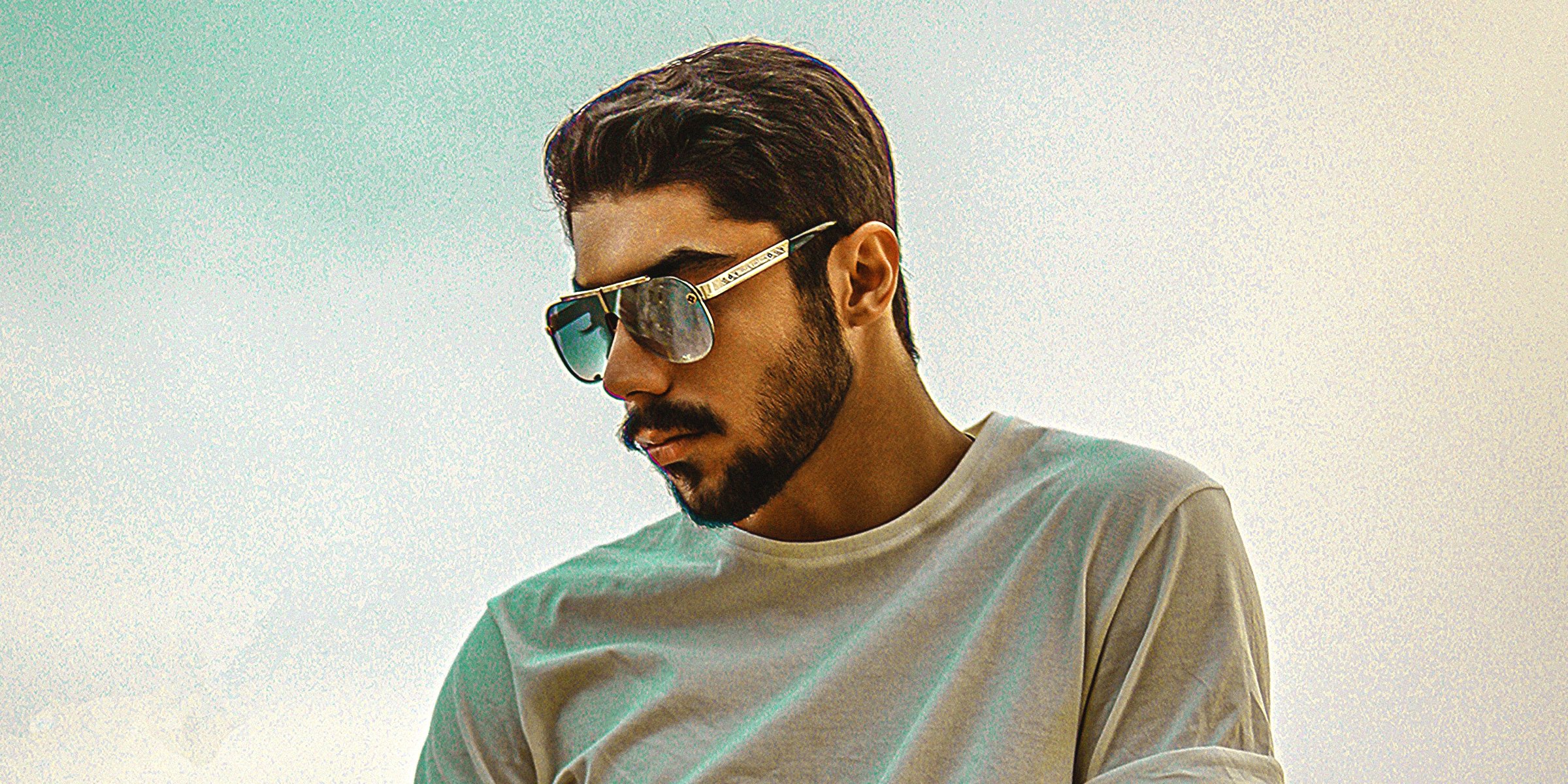Unsplash | Photo of a young man in sunglasses