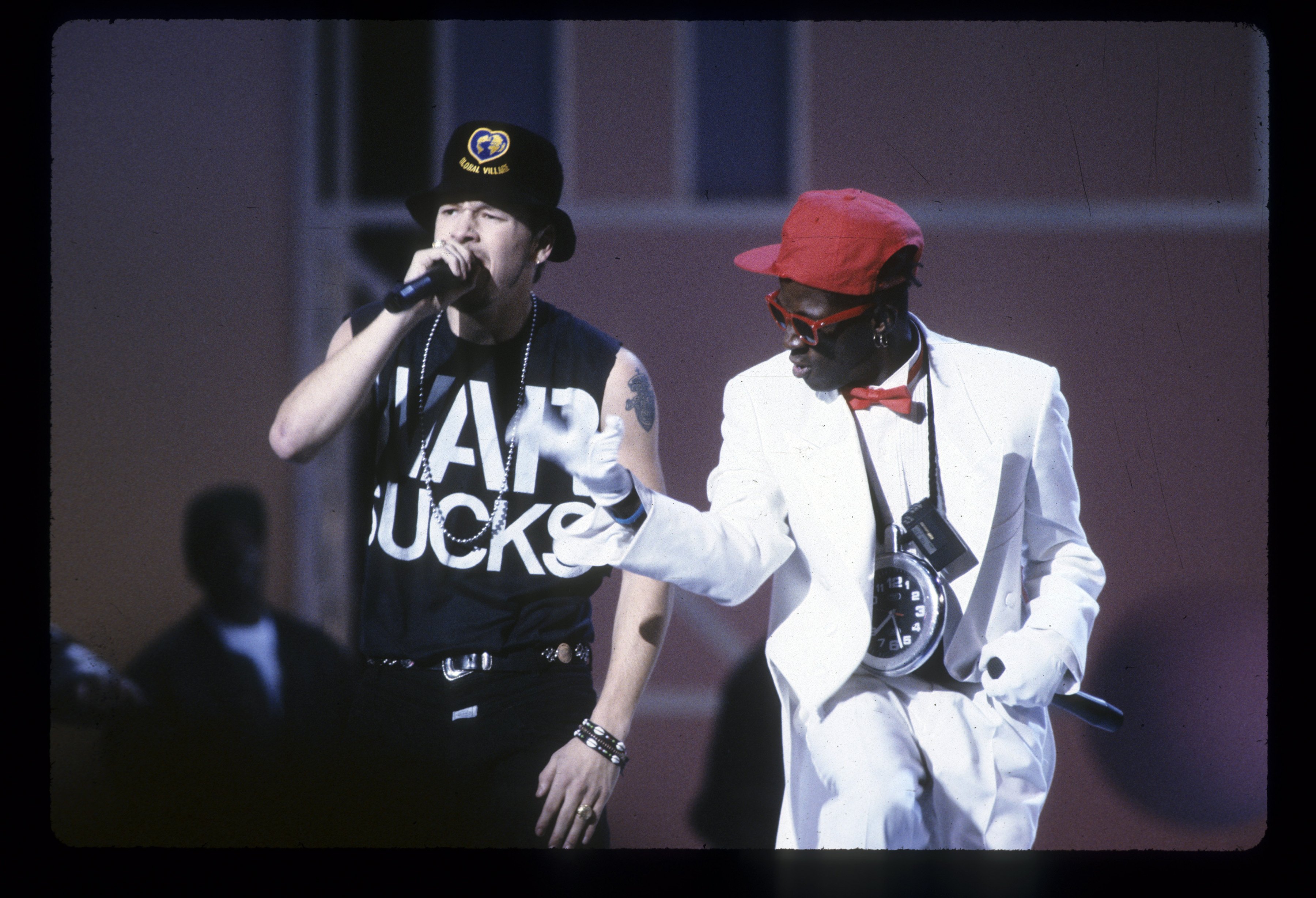 Donnie Wahlberg of New Kids on the Block and Flavor Flav perform at the 1991 American Music Awards on January 28, 1991. | Photo: Getty Images