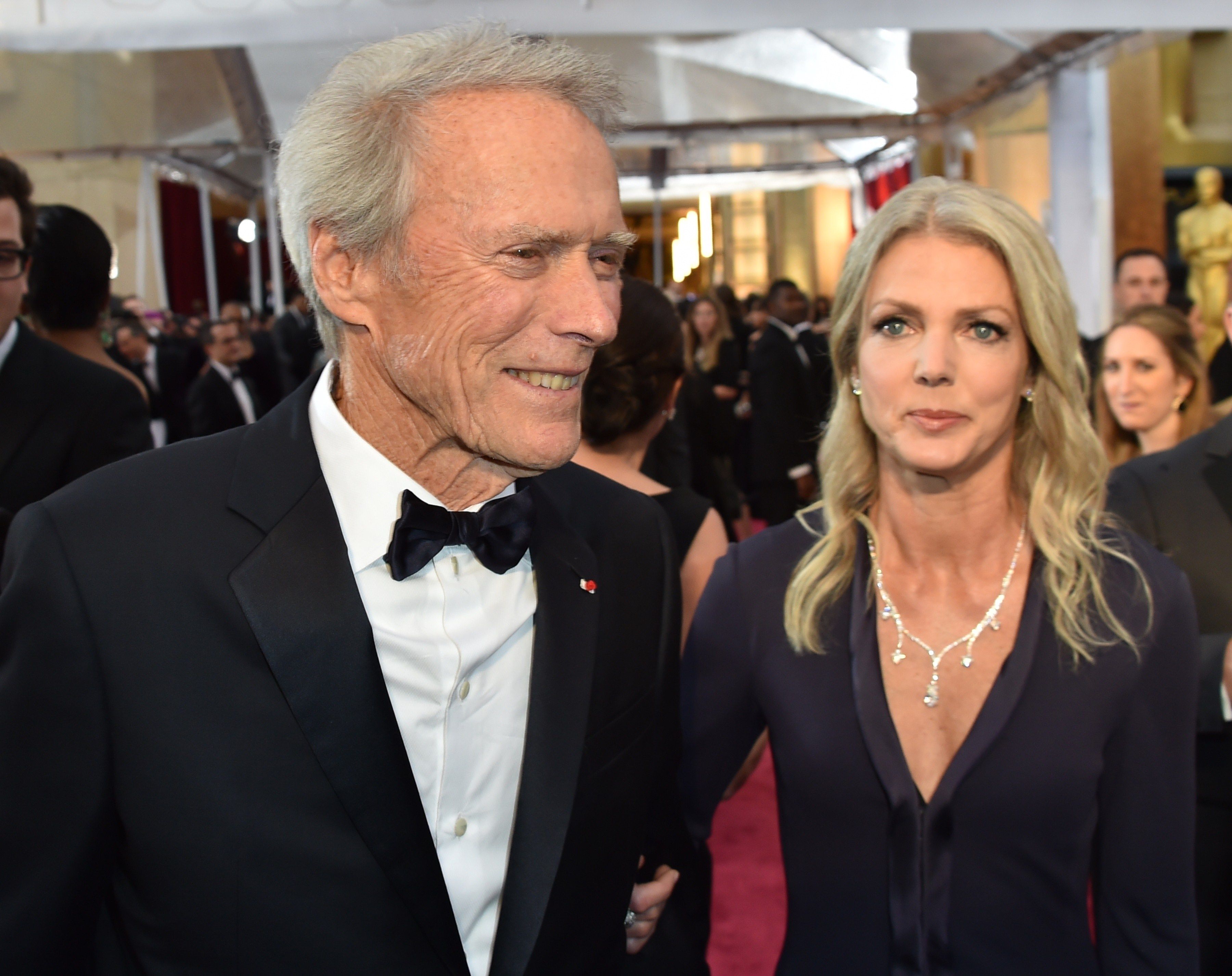 Clint Eastwood and Christina Sandera during the 87th Oscars on February 22, 2015 in Hollywood, California. | Source: Getty Images