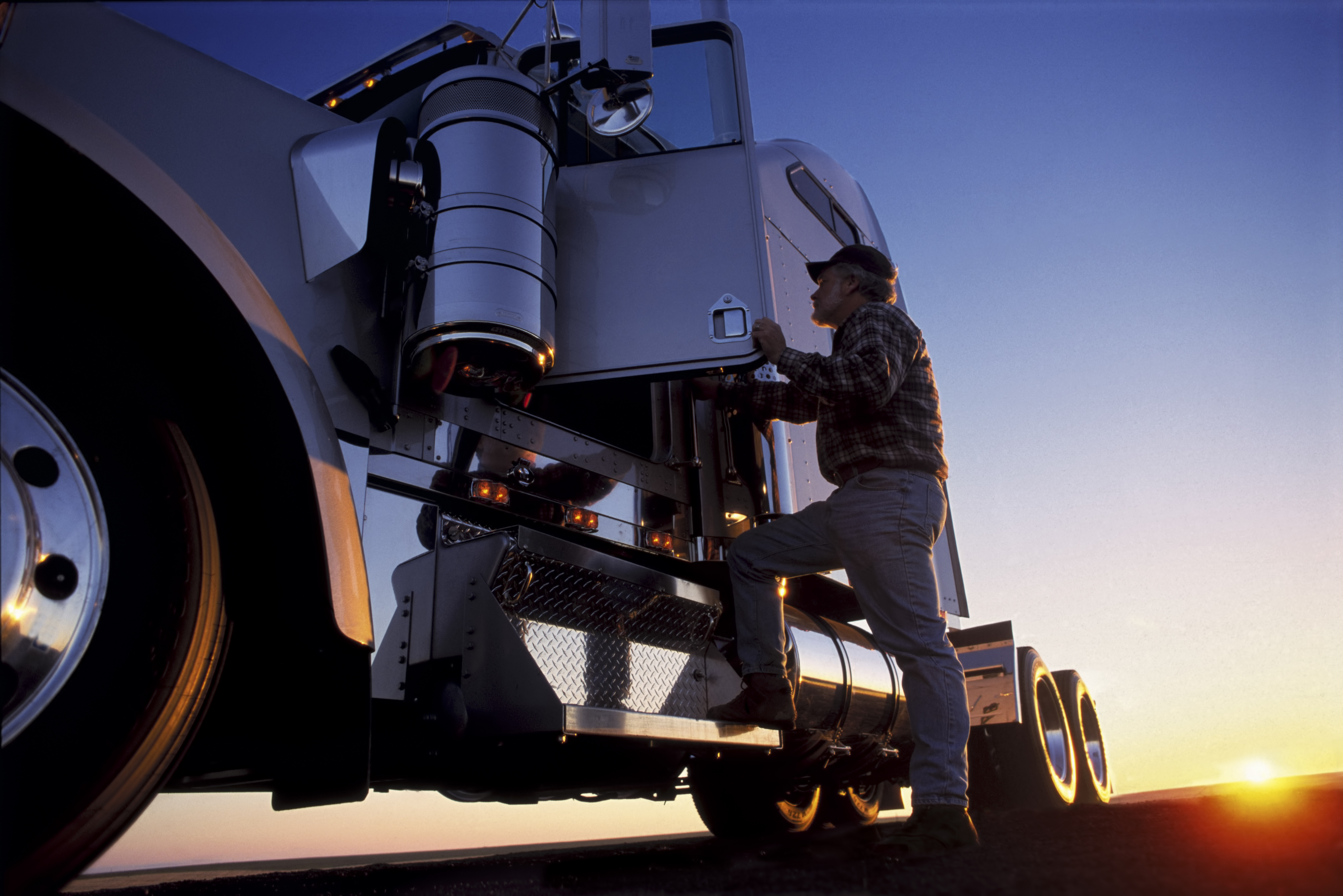 A man getting into the cab of his truck. | Source: Getty Images